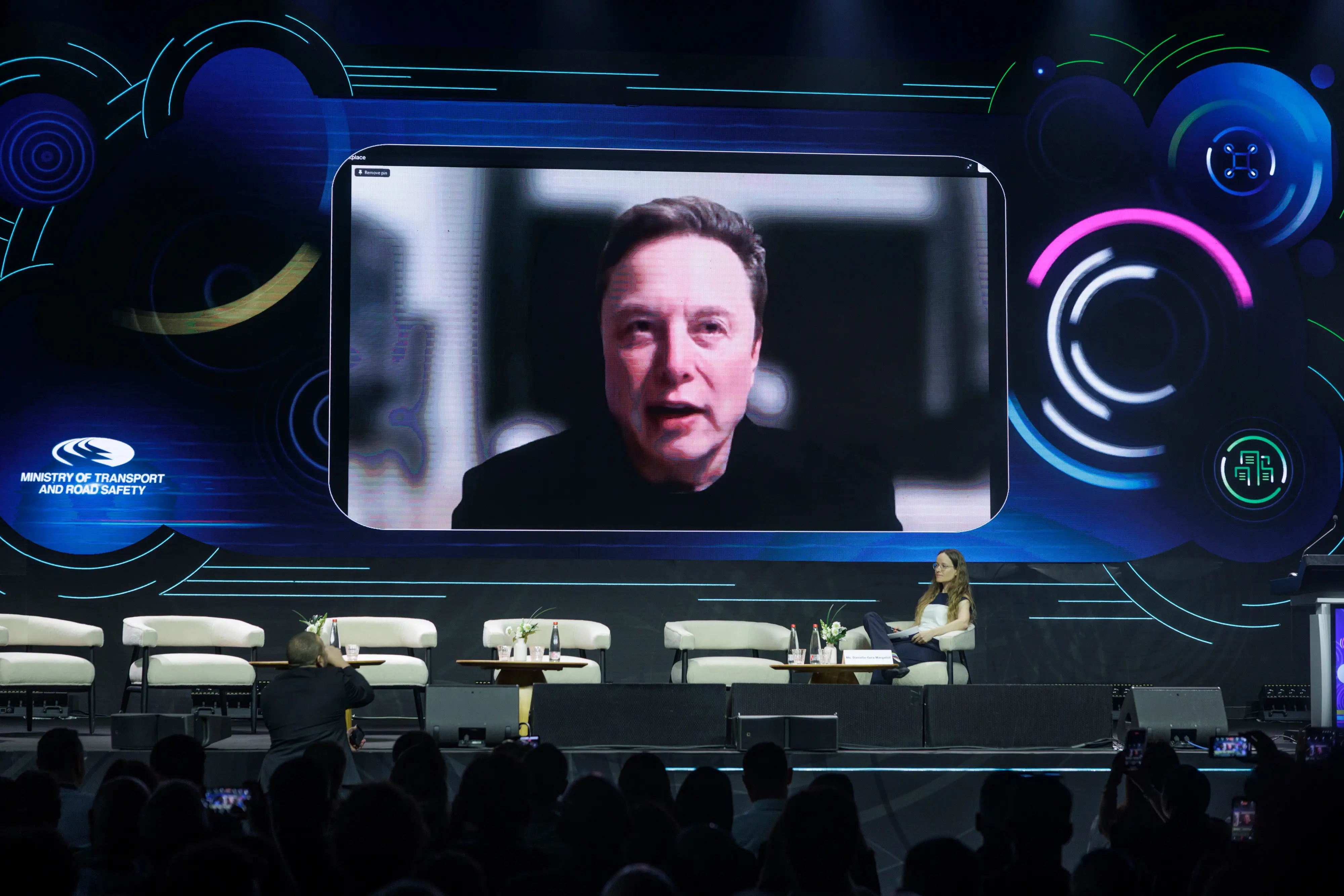 Elon Musk virtually at a conference.