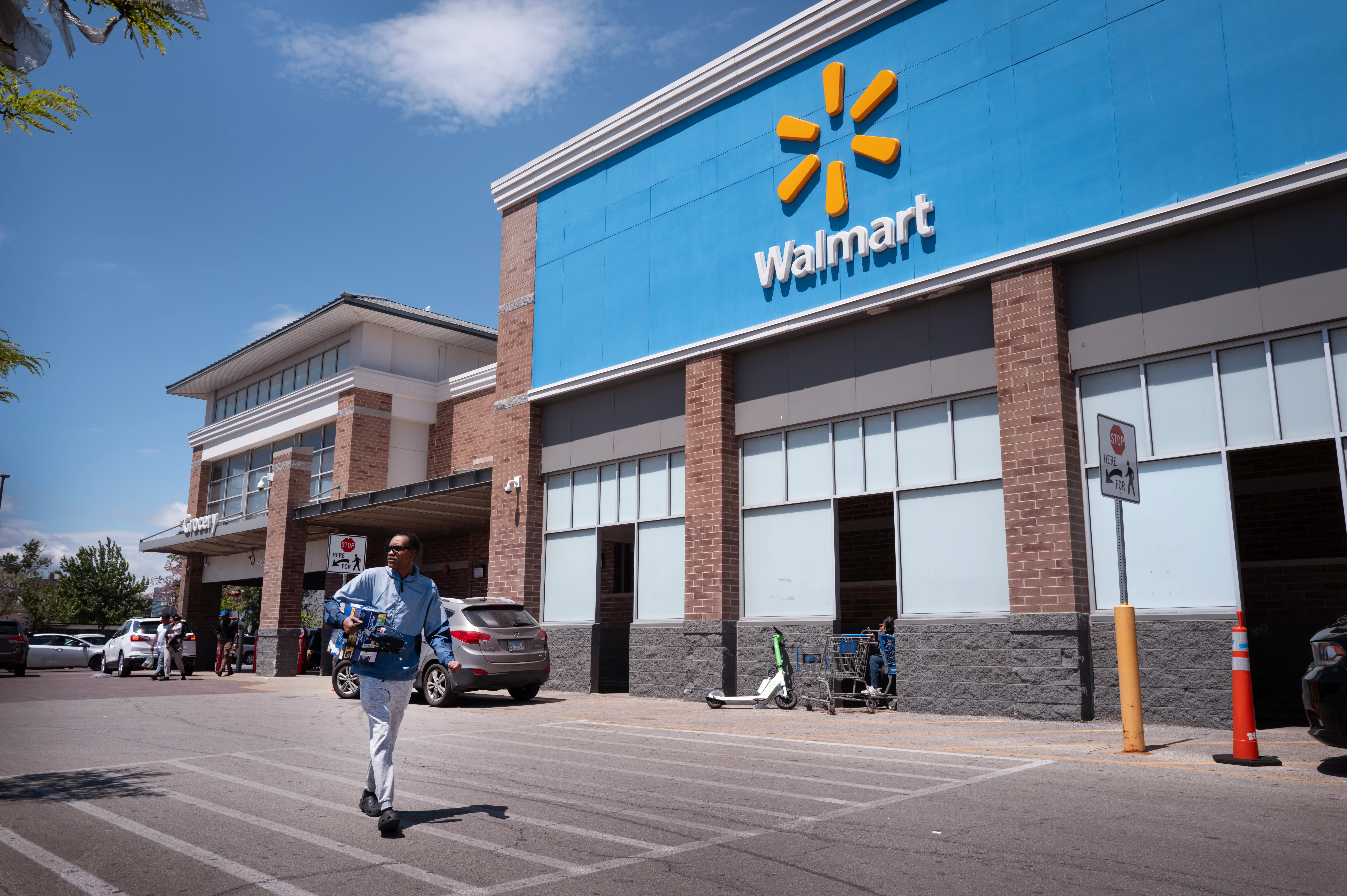 Customers shop at a Walmart store on May 13, 2026 in Chicago, Illinois.