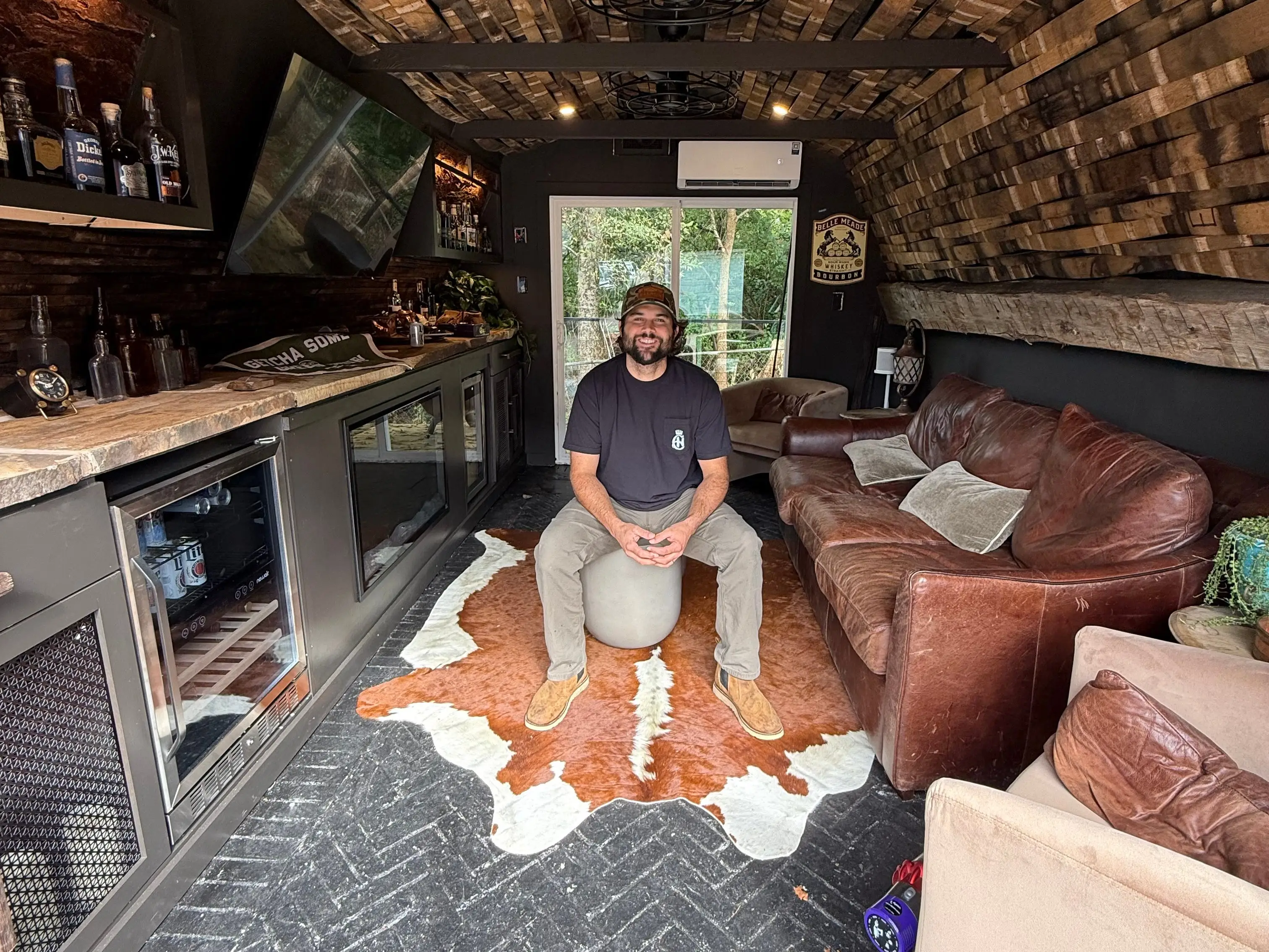 Tyler Graham inside his backyard man cave.