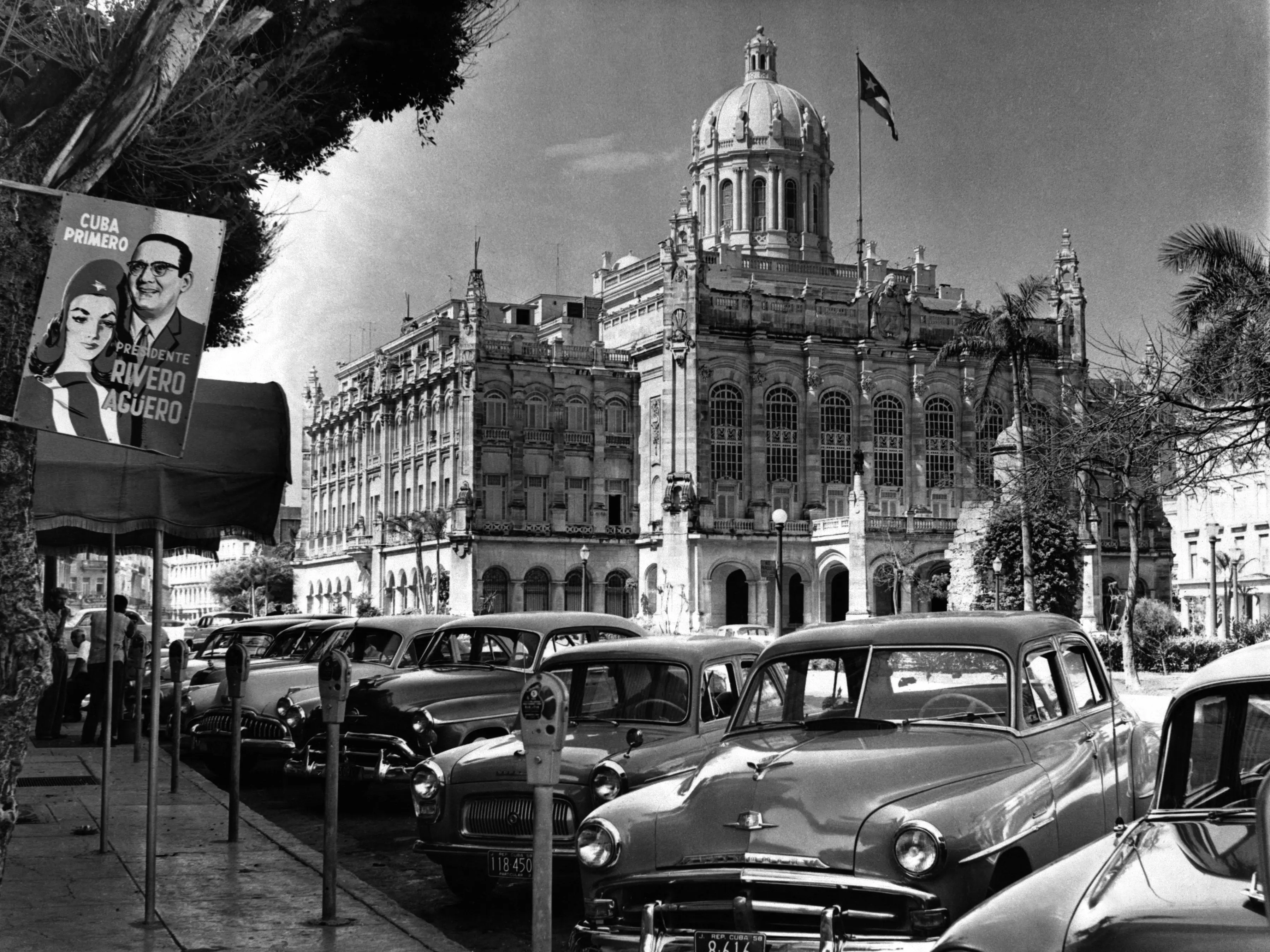 New cars line the street outside the Presidential Palace in Havana, Cuba, in September 1958. The palace was the official residence of dictator Fulgencio Batista, who was overthrown later that same year by Fidel Castro's forces.