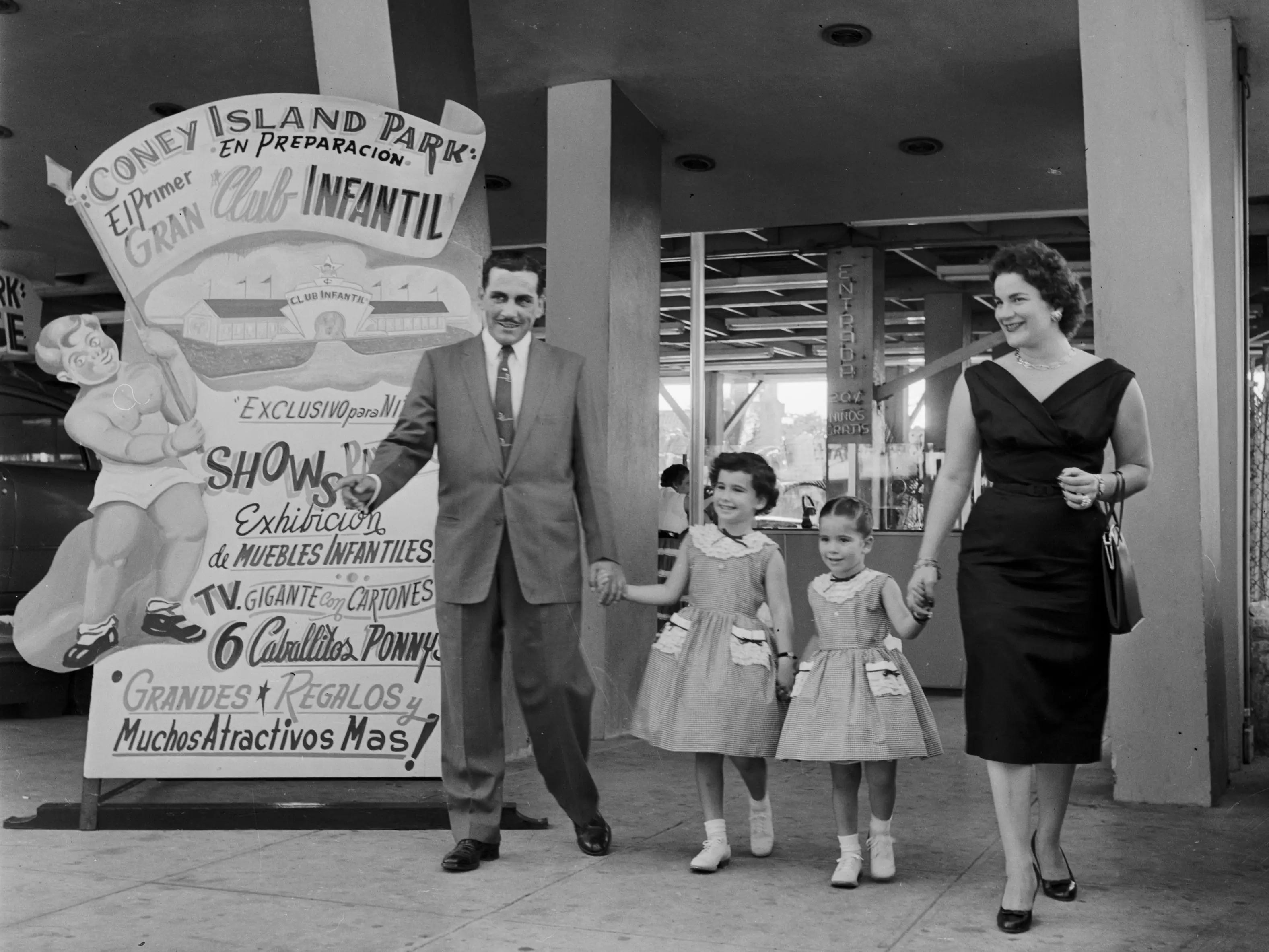 circa 1955: The Gondar family leaving Havana's Coney Island theme park.
