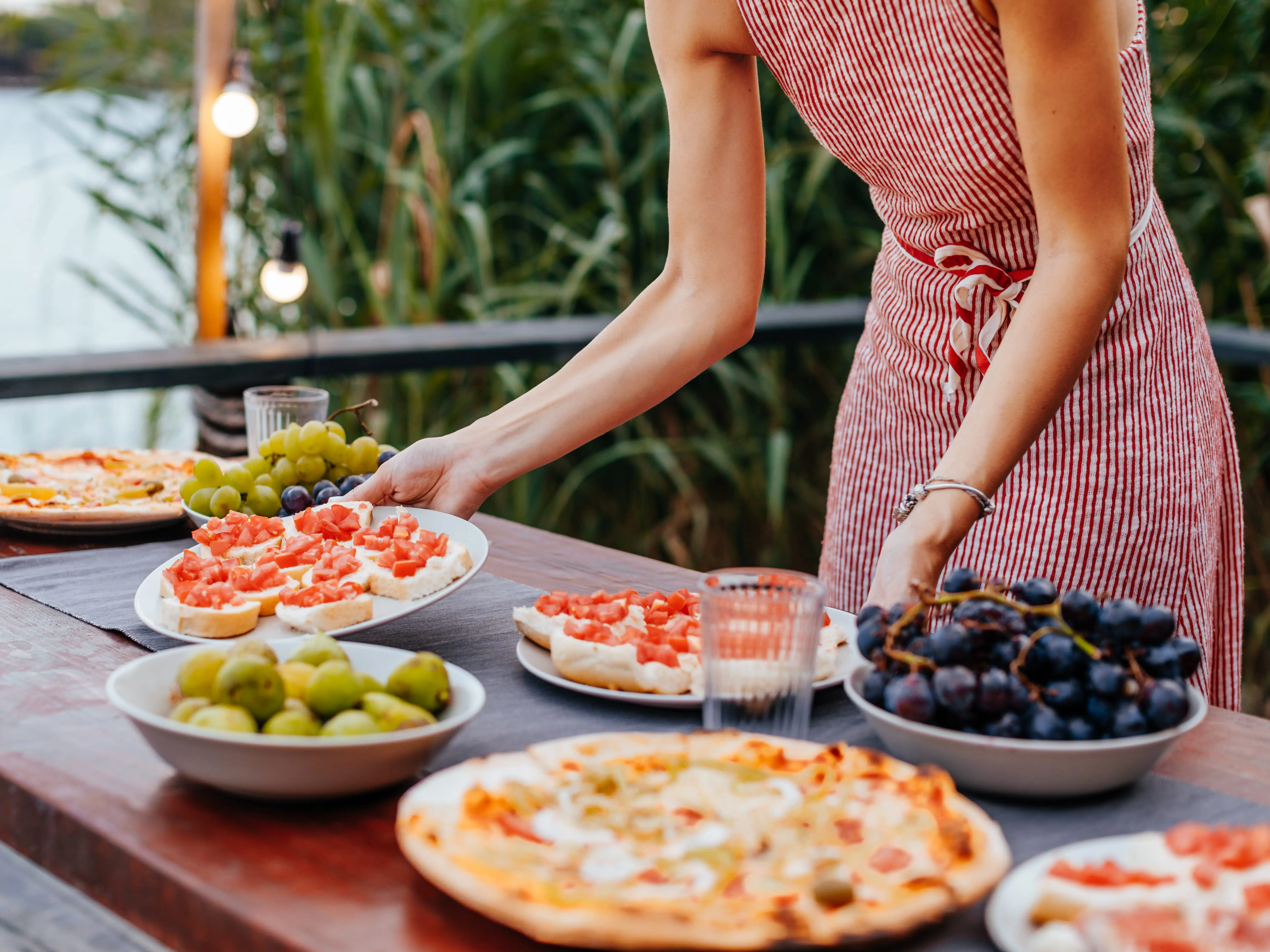 Woman setting appetizers out
