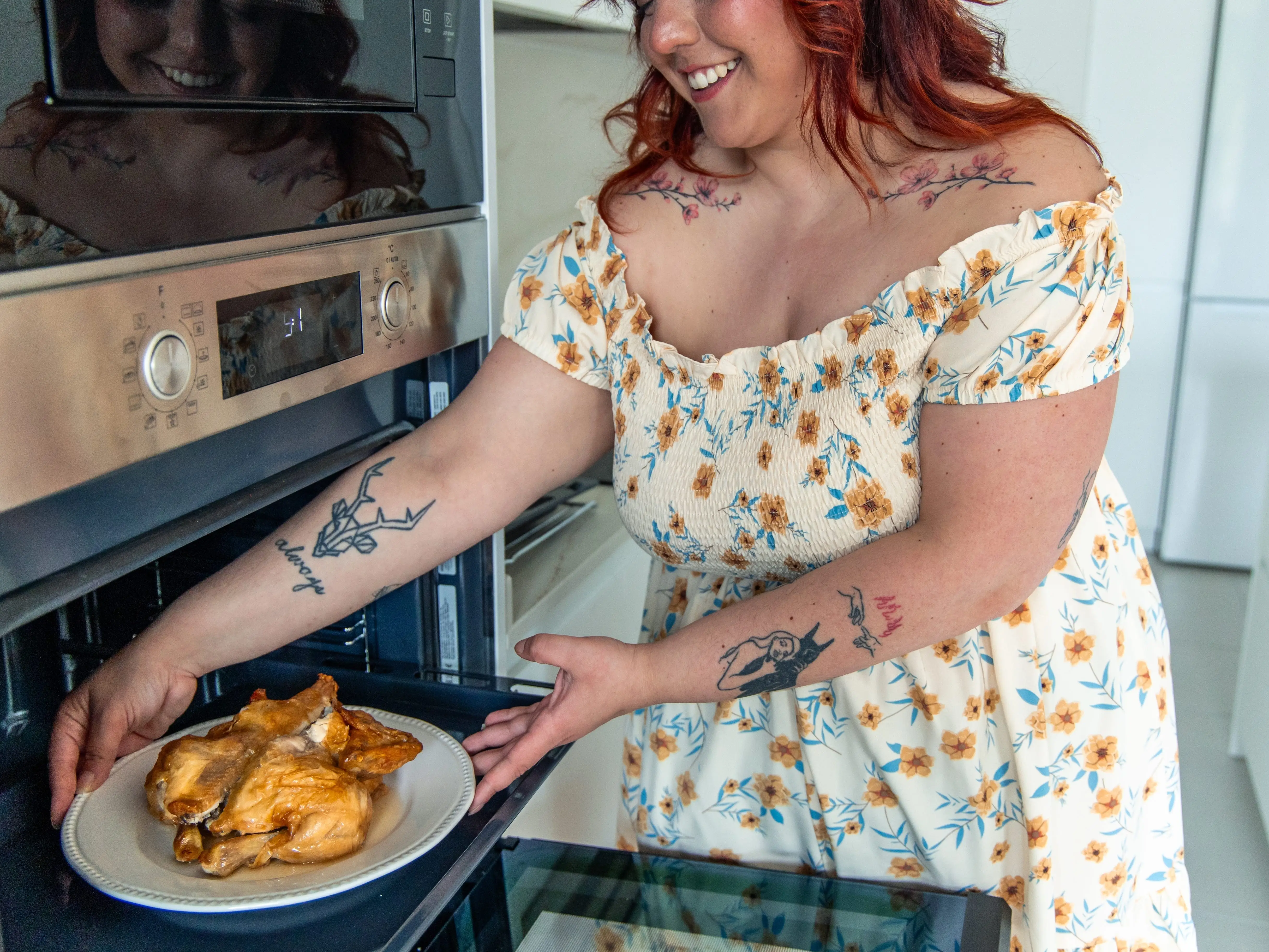 woman heating food in oven