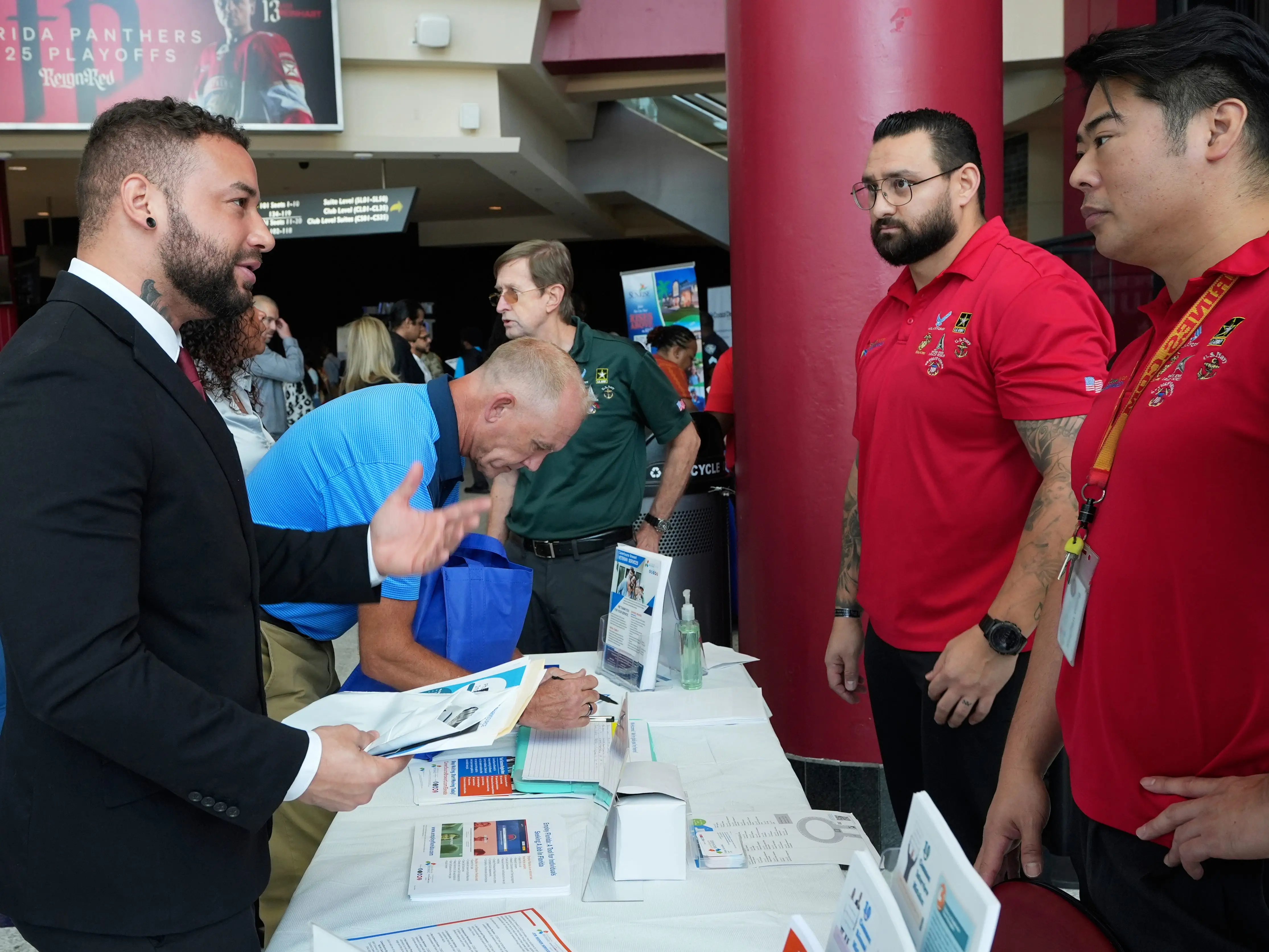 men gather at a job fair