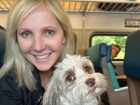 The author poses with her dog.