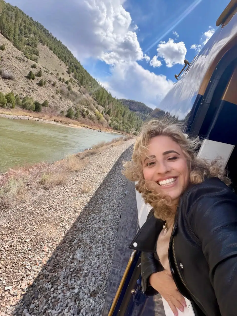 The author leaning out of the window of the train.