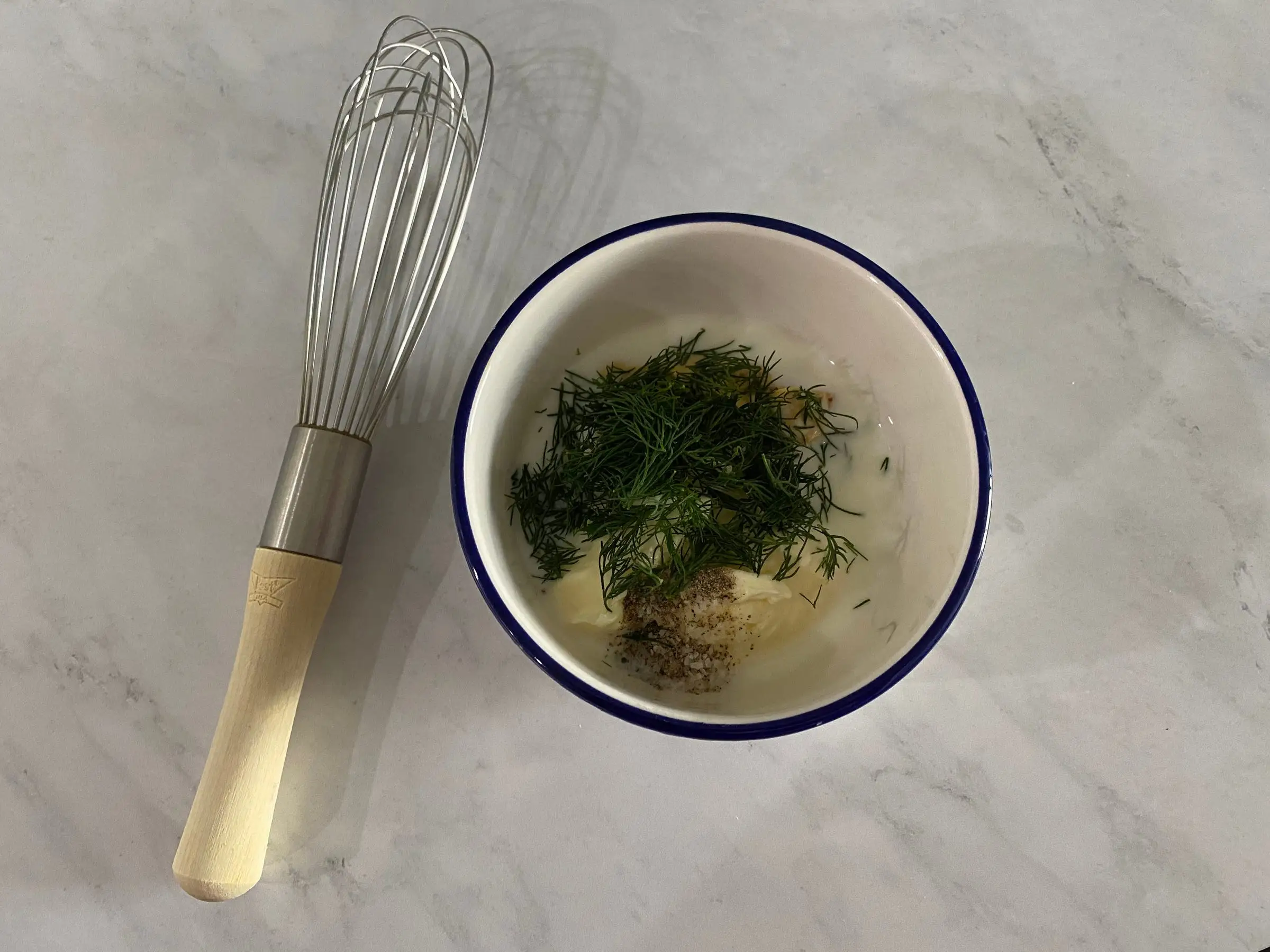 whisk next to bowl of ingredients