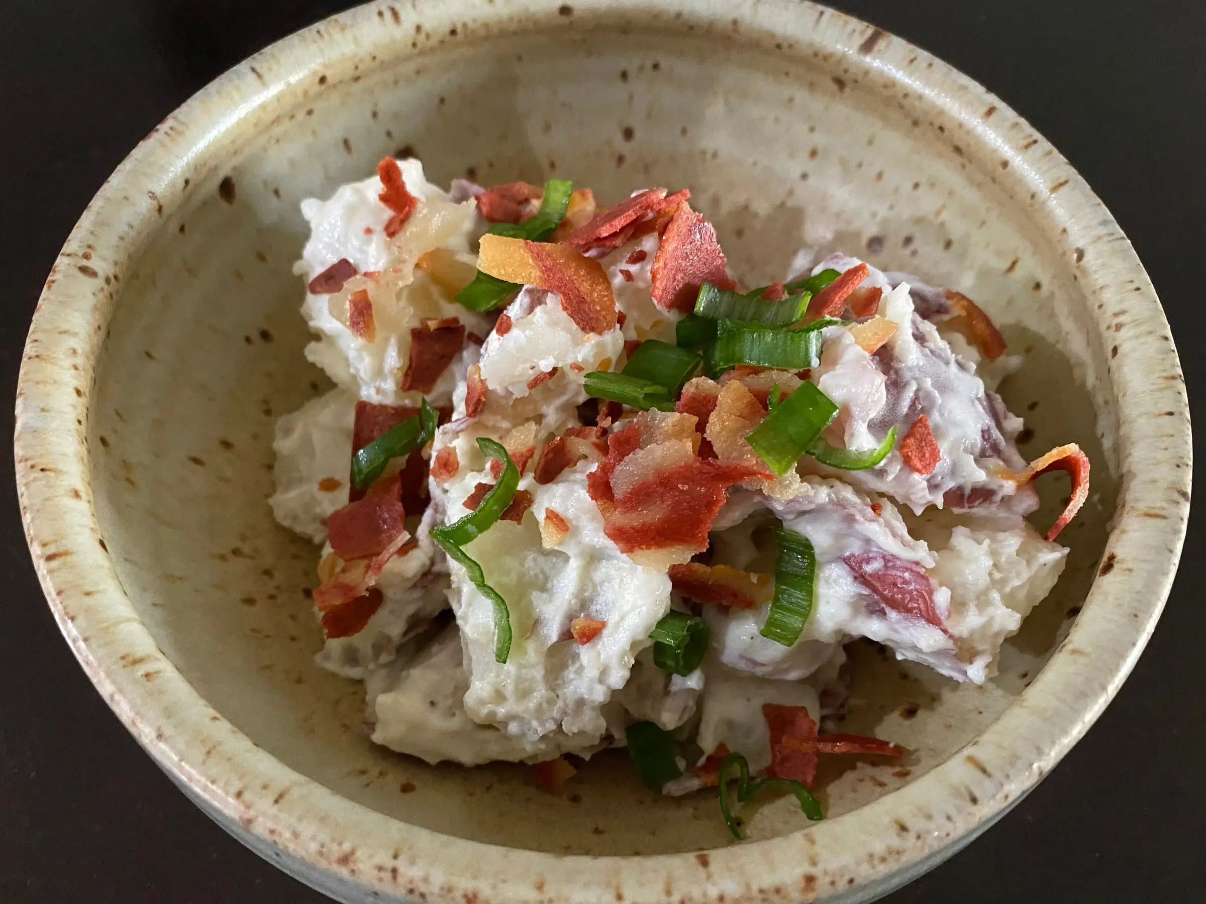 potato salad with bacon, green onion