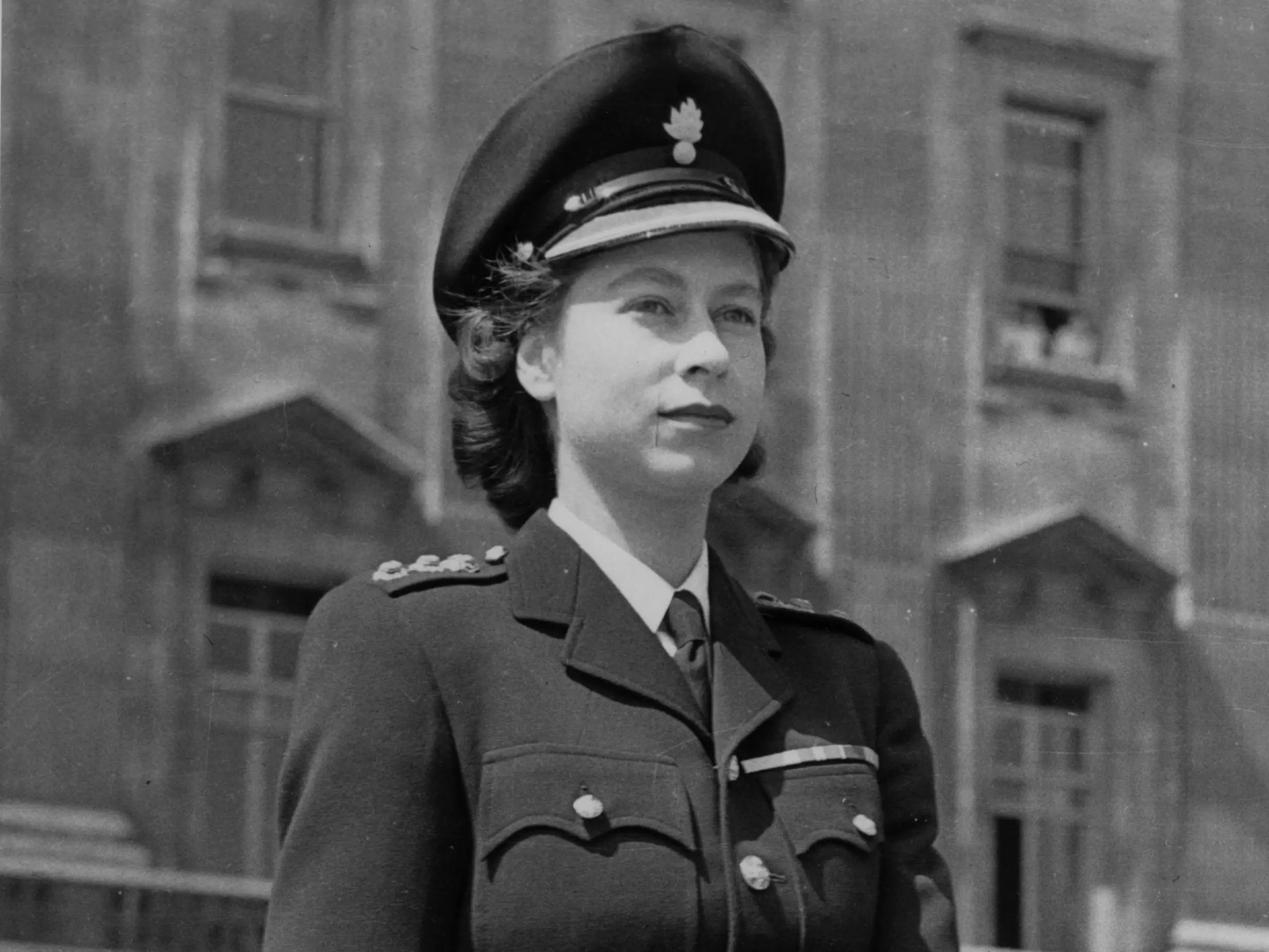 Princess Elizabeth rides out from Buckingham Palace, London to the Horse Guards' Parade, wearing a new military hat bearing the insignia of the Grenadier Guards.