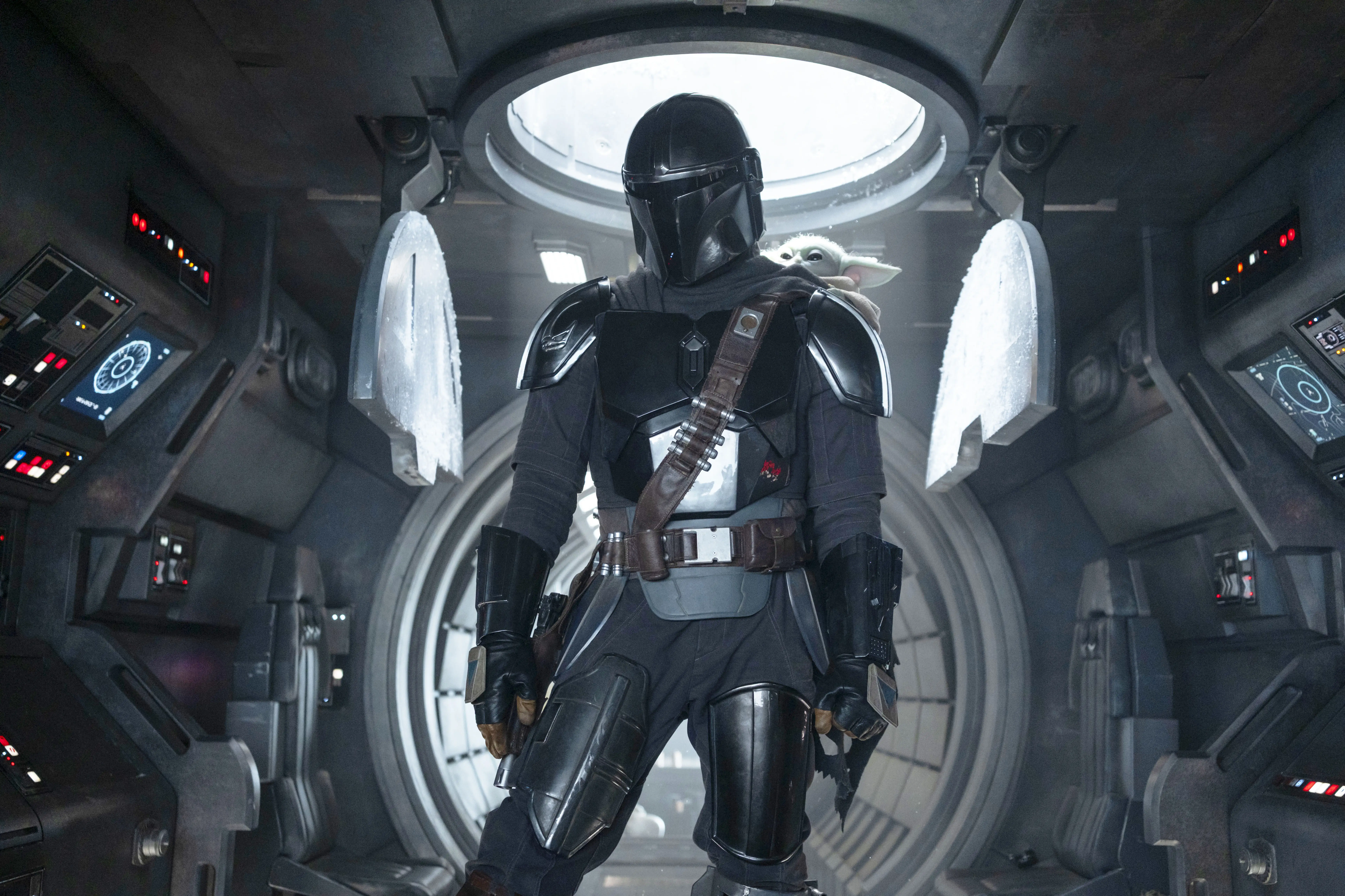 The Mandalorian and Grogu in a ship