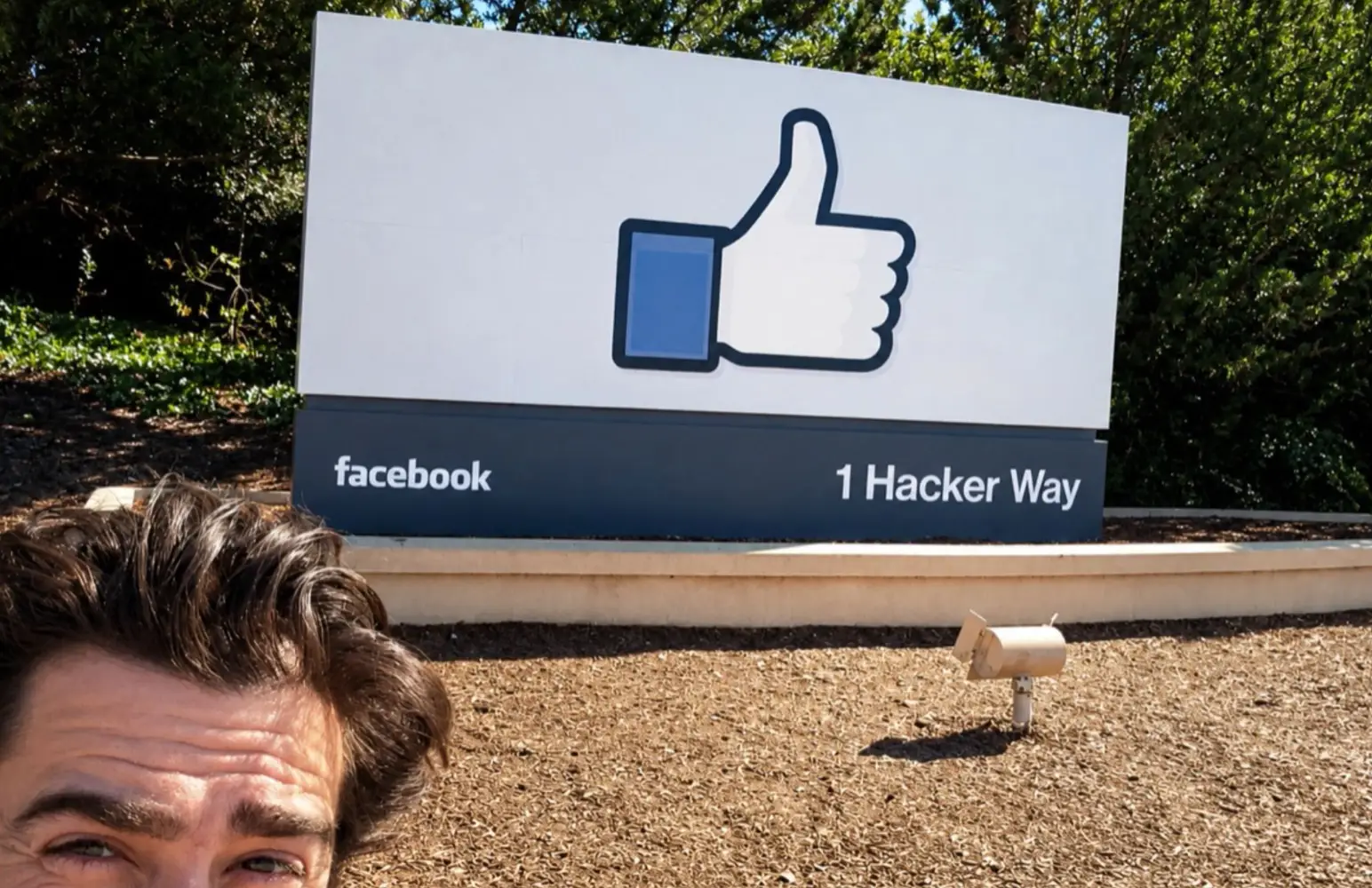 Tom Gilmartin in front of the facebook sign
