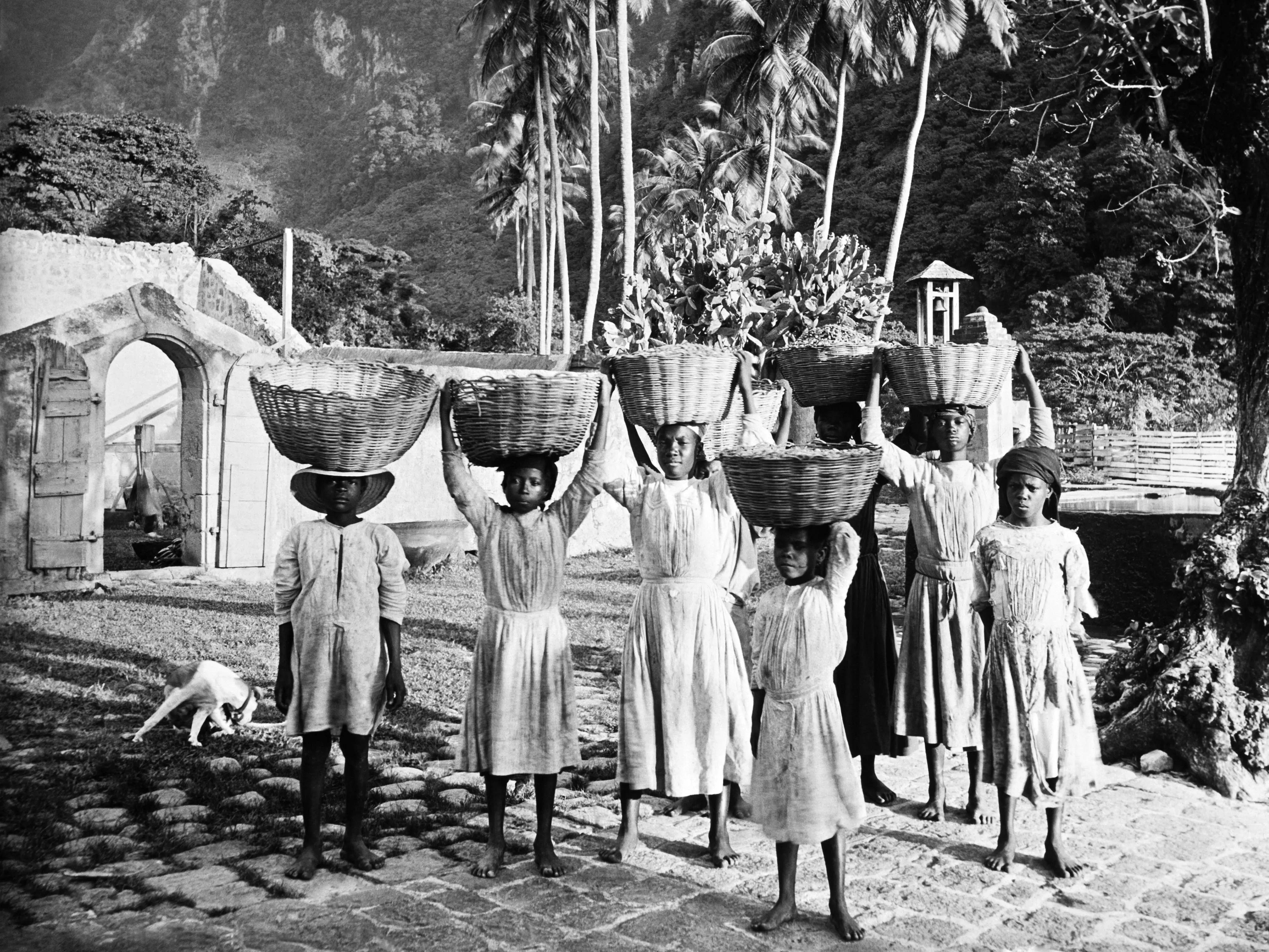 CUBA - CIRCA 1930: Youth Wearing Wares on their Head, in Cuba, circa 1930