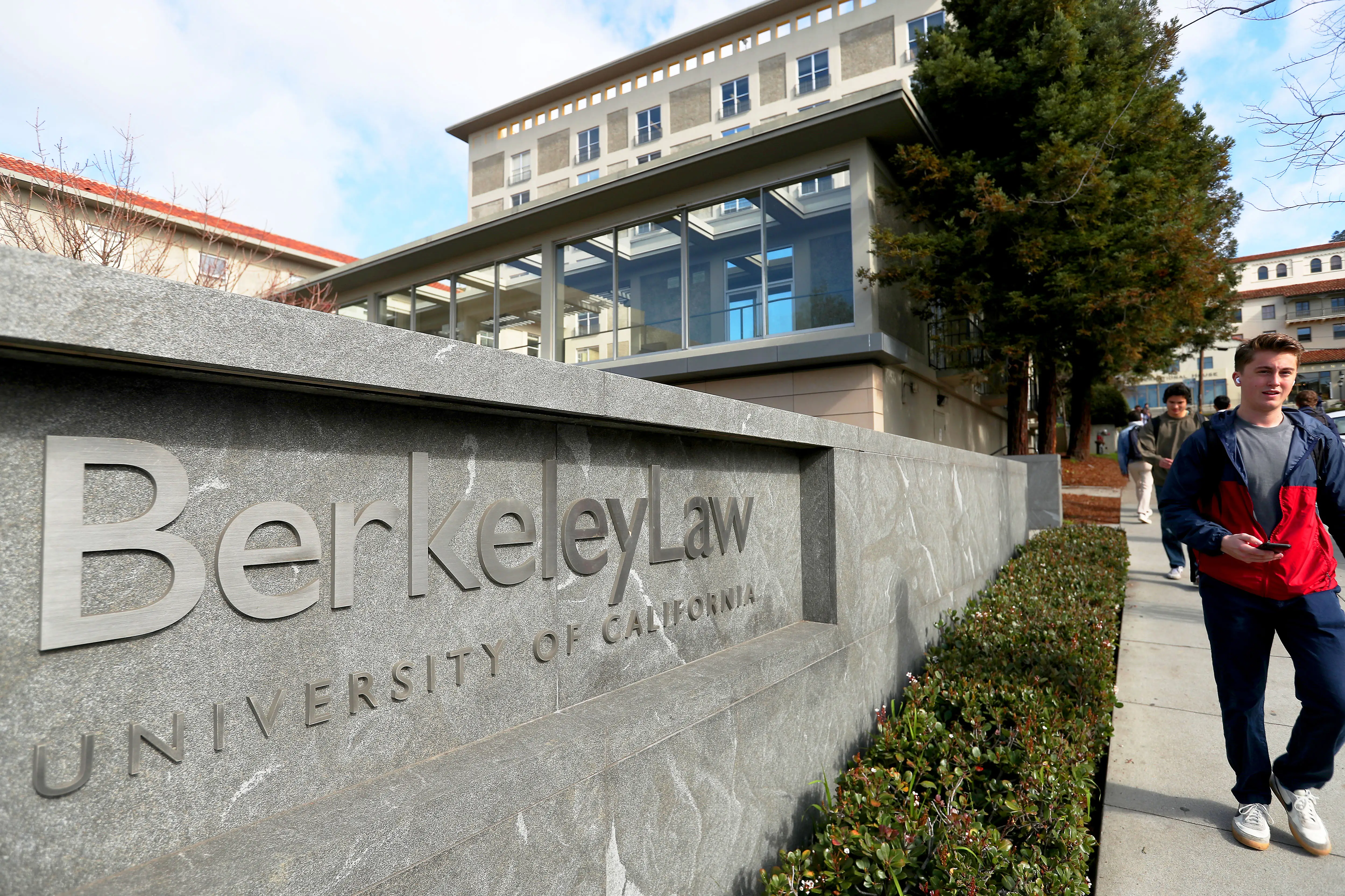 Students walk past UC Berkeley's former Boalt Hall in Berkeley, California.