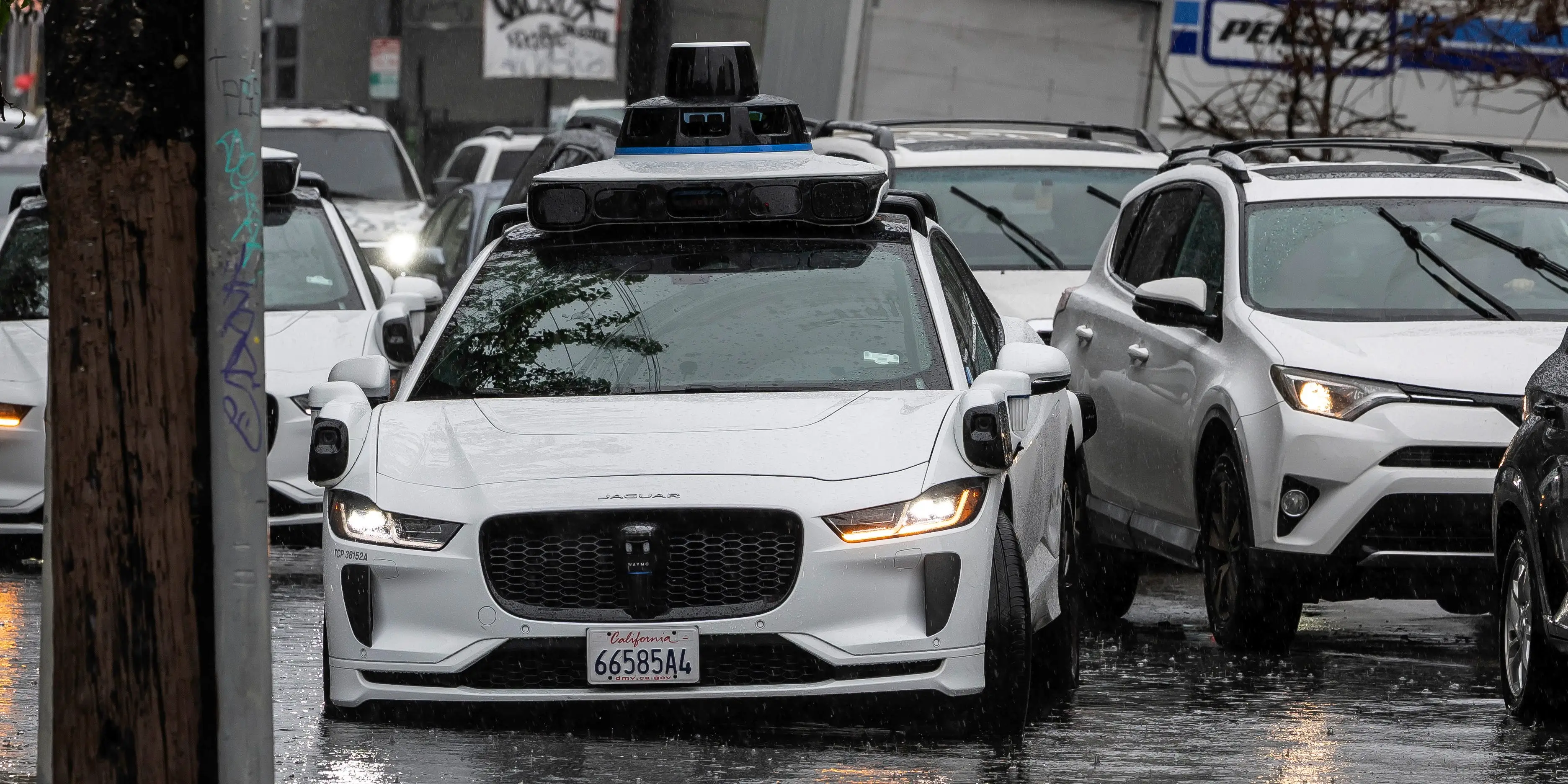 Waymo driving through flooded road