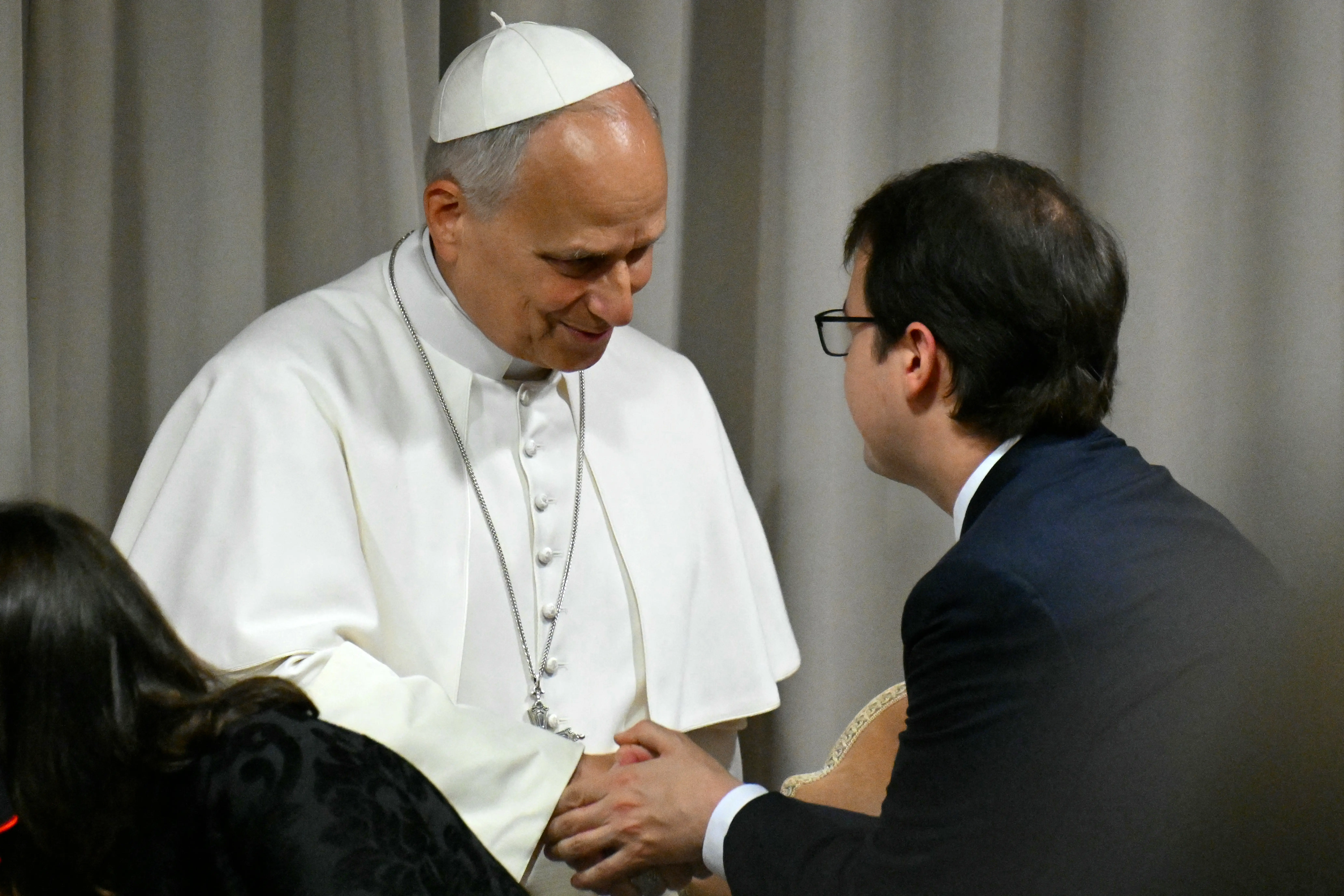 Co-founder of Anthropic, Christopher Olah, shakes hands with Pope Leo XIV