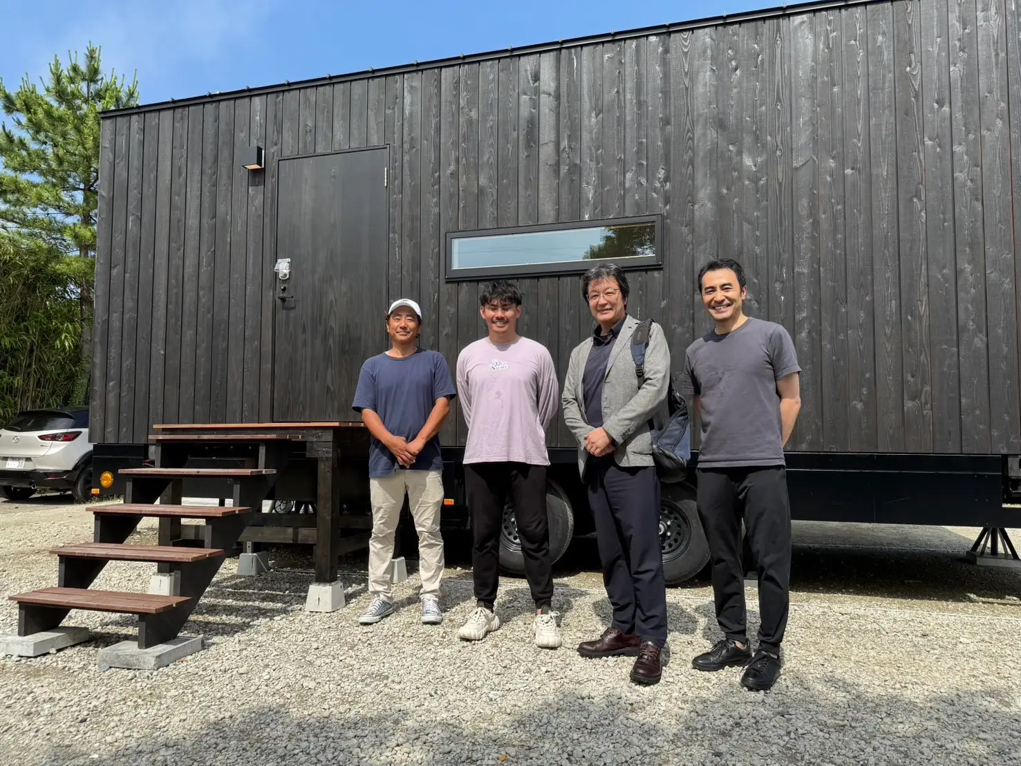 Standing outside of a cabin from A Cabin Company in Japan.