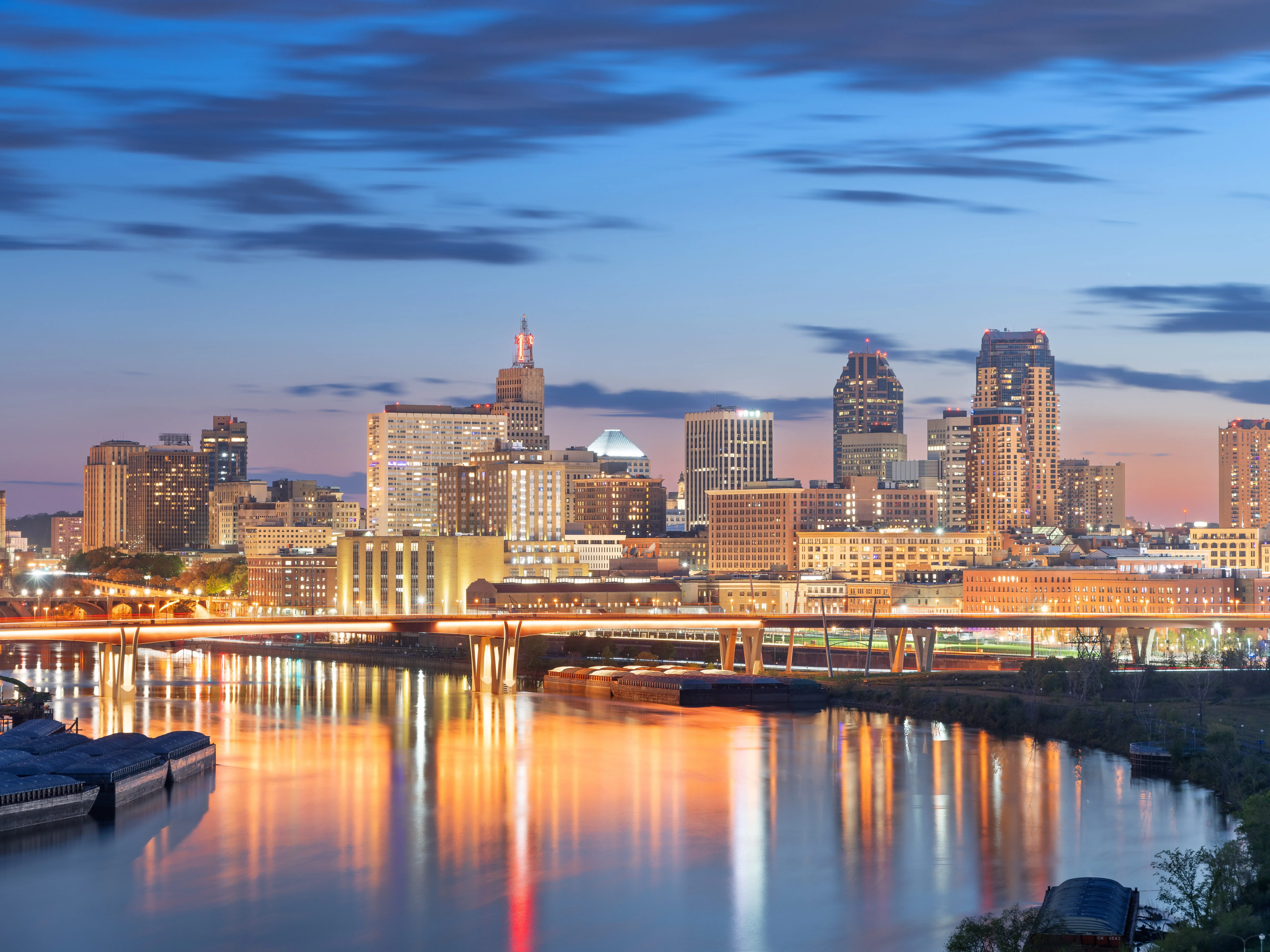Saint Paul, Minnesota, USA downtown skyline on the Mississippi River at dusk.