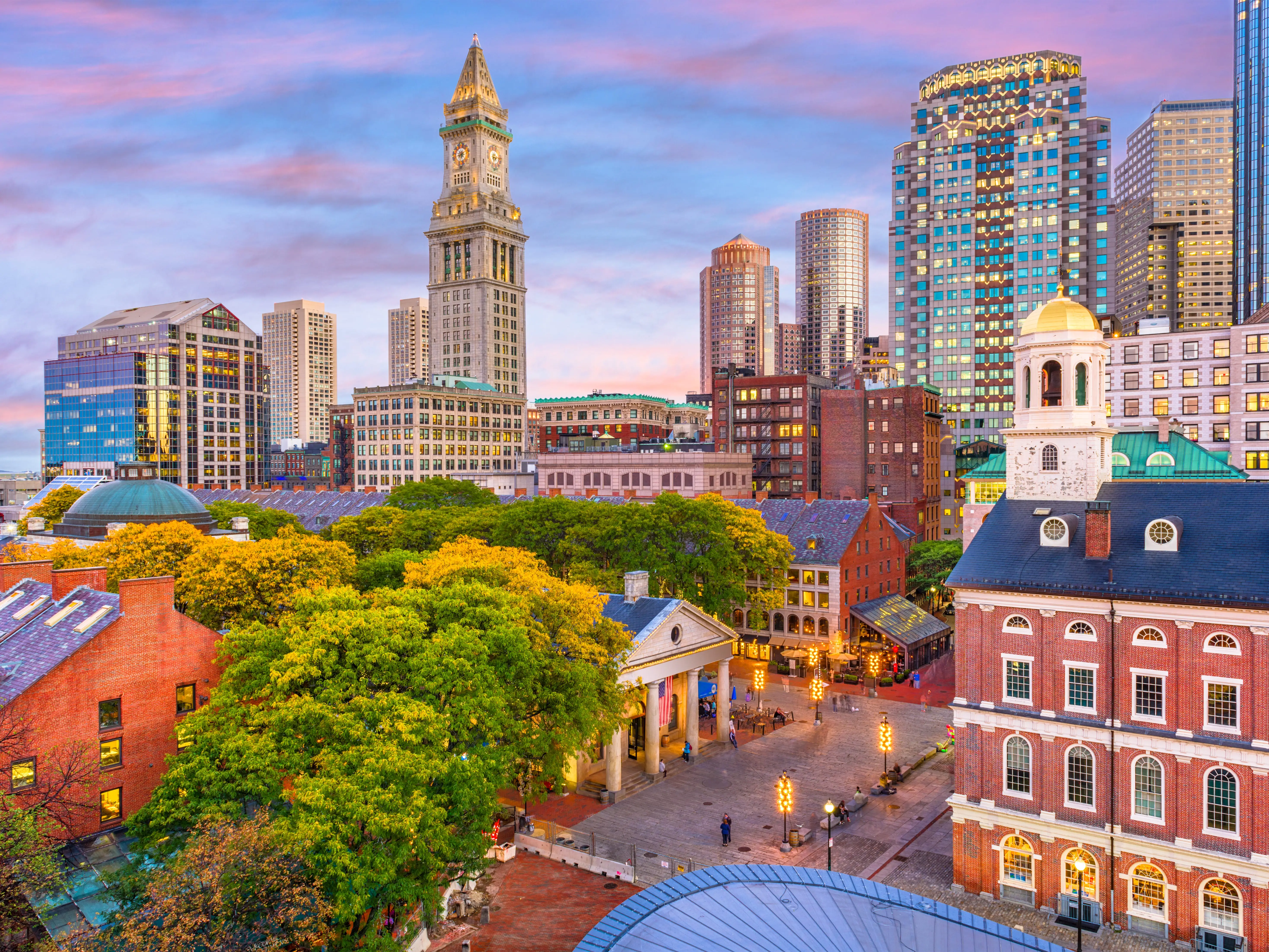 Boston, Massachusetts, USA skyline with Faneuil Hall and Quincy Market at dusk.