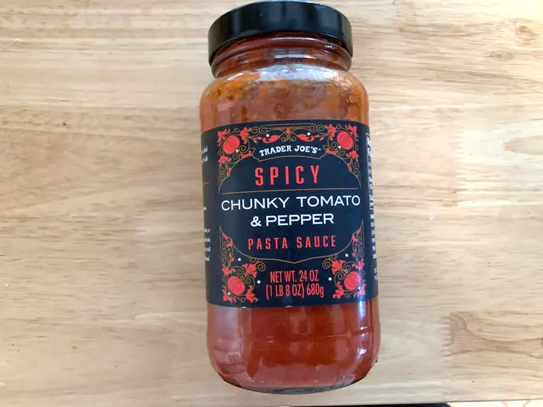 A jar of Trader Joe's spicy chunky-tomato and pepper pasta sauce.