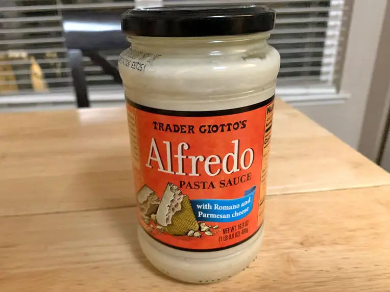 A jar of Trader Joe's Alfredo sauce.