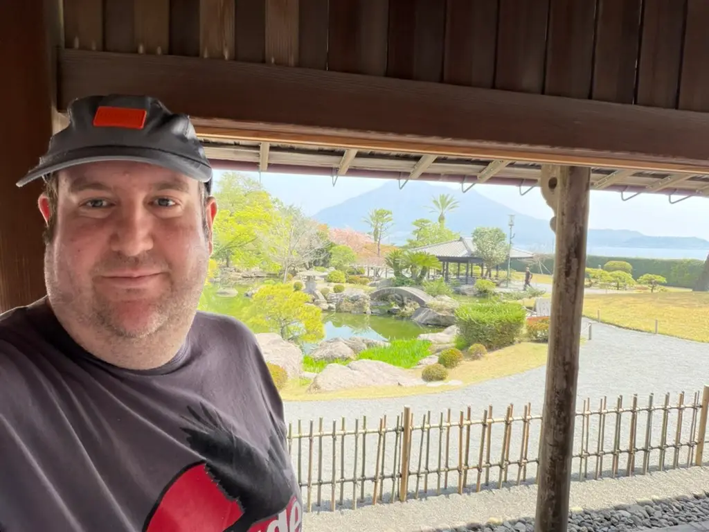 Man smiling in selfie in Japan
