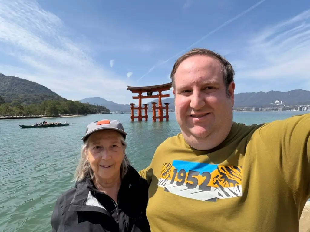 Man smiling in selfie with woman