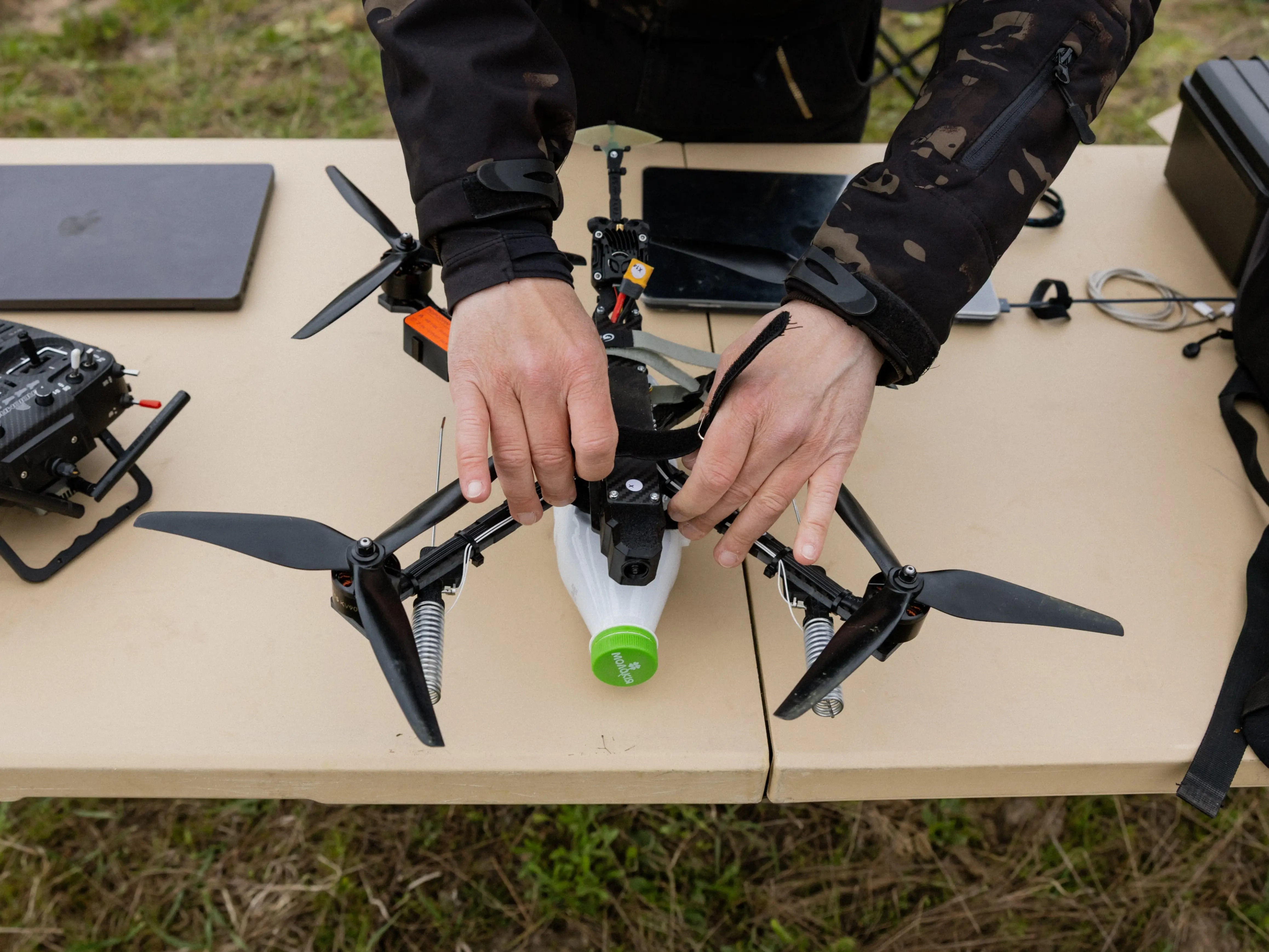 A person works on a drone during a test event in Ukraine.