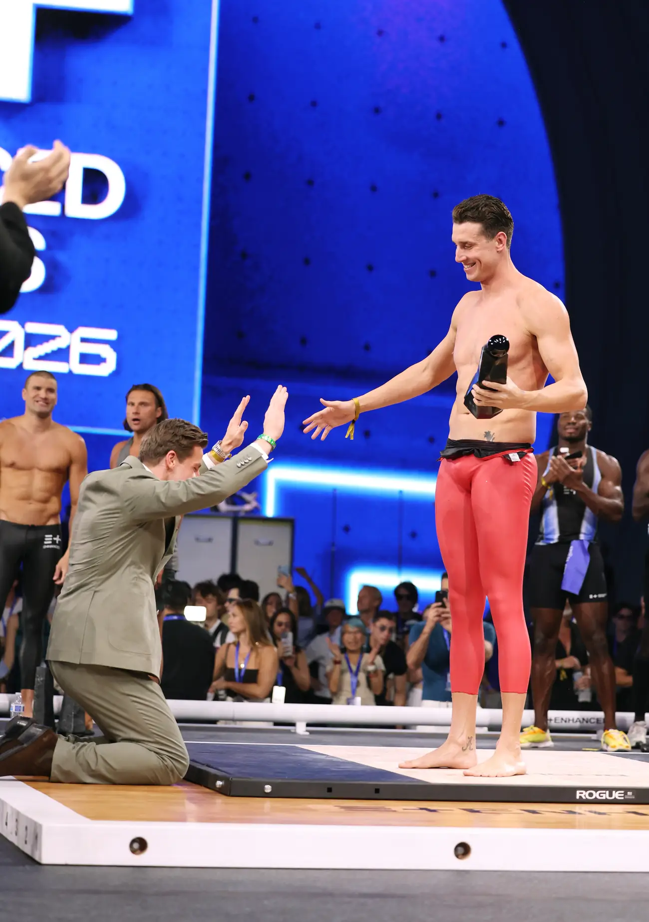 Enhanced Games Co-founder and CEO Maximilian Martin, left, bows jovially to Kristian Gkolomeev during an awards ceremony at the 2026 Enhanced Games
