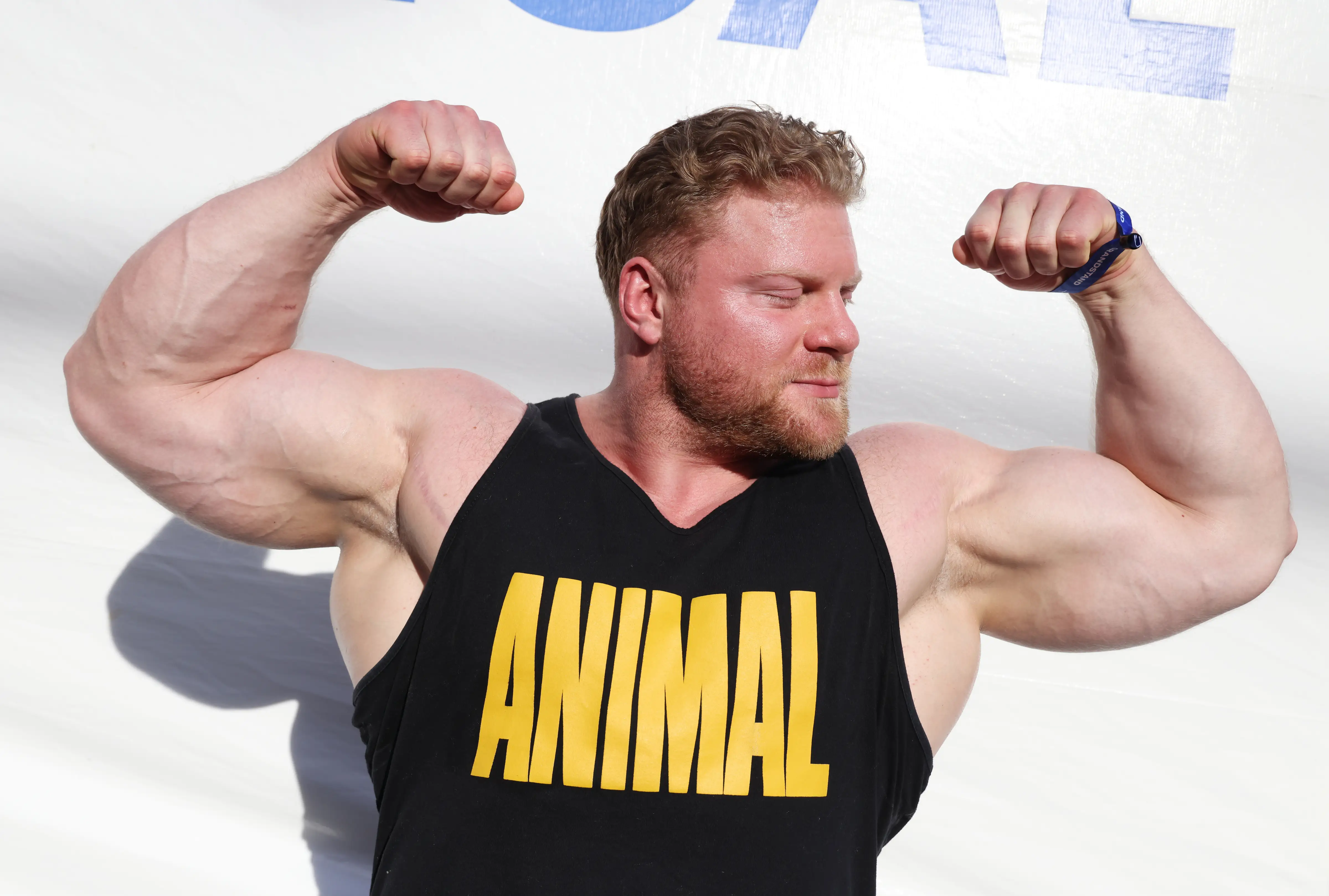 Attendee and powerlifter Kyle Kirby, of Atlantic City, poses for a photo near a refreshments area at the 2026 Enhanced Games