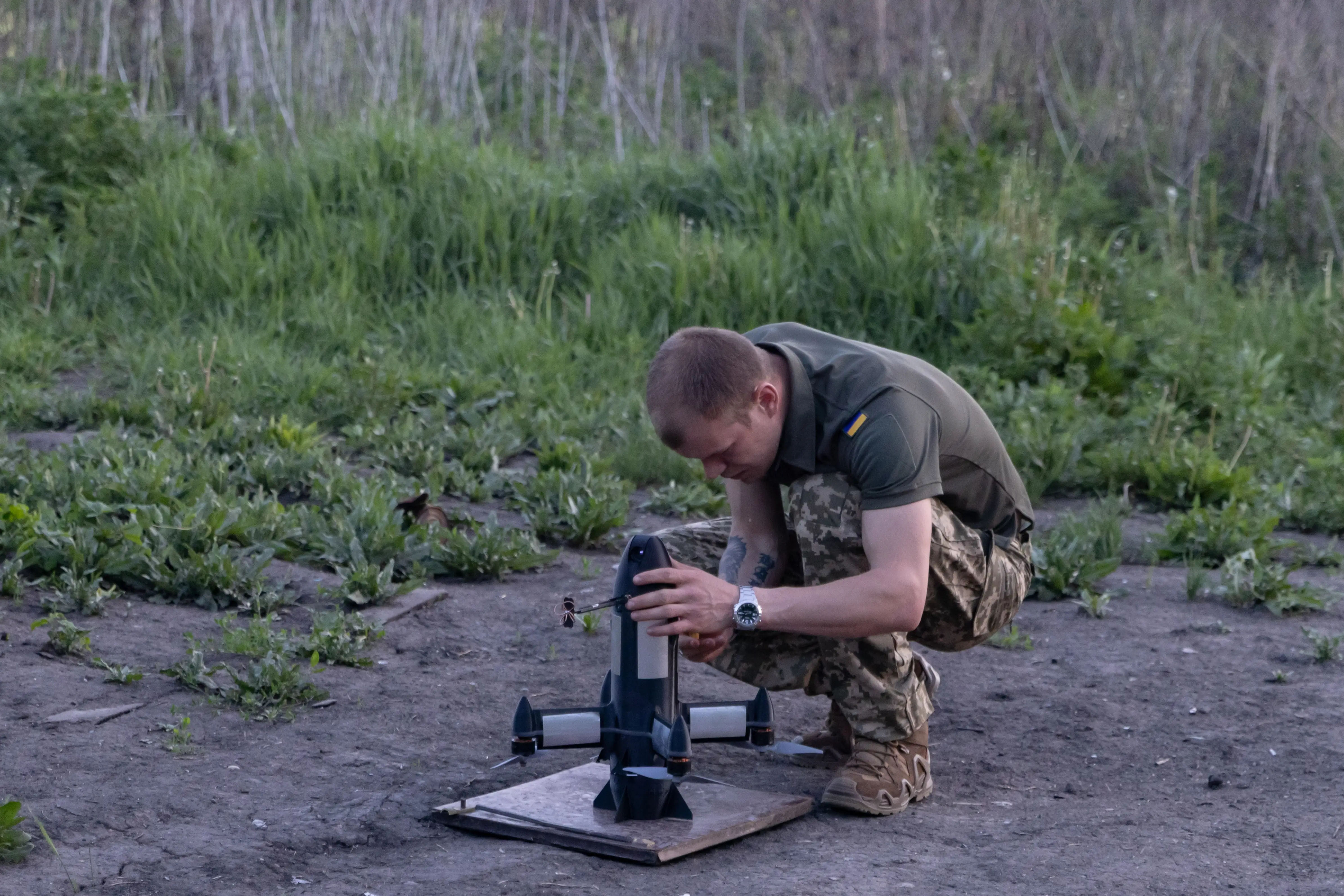 A serviceman of the 116th Mechanized Brigade prepares a Ukrainian-made P1-Sun interceptor drone for launch on May 20, 2026, in Kharkiv Oblast, Ukraine.