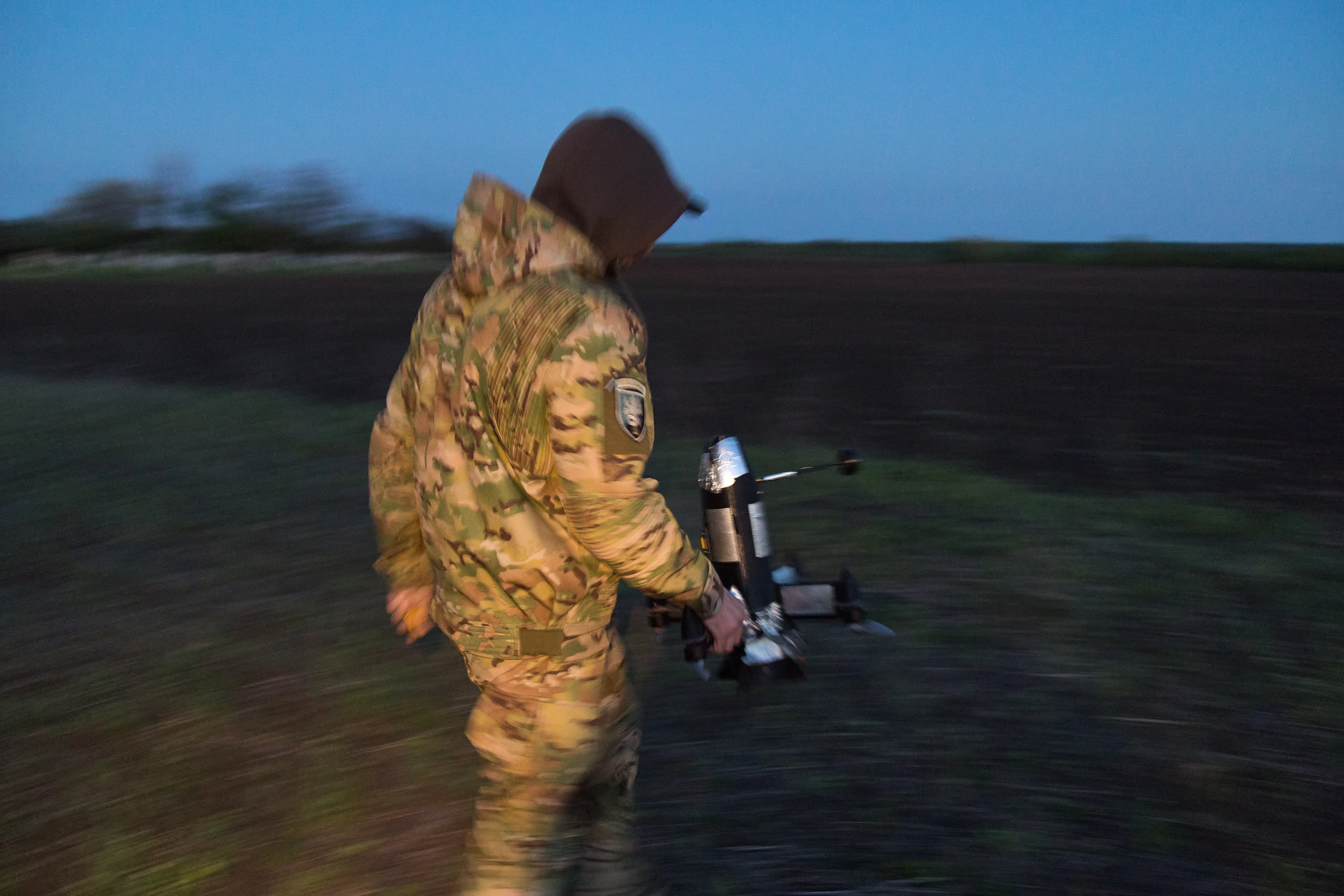 A Ukrainian soldier prepares to launch an interceptor drone during an air defense operation near the Donetsk front line on May 12, 2026.