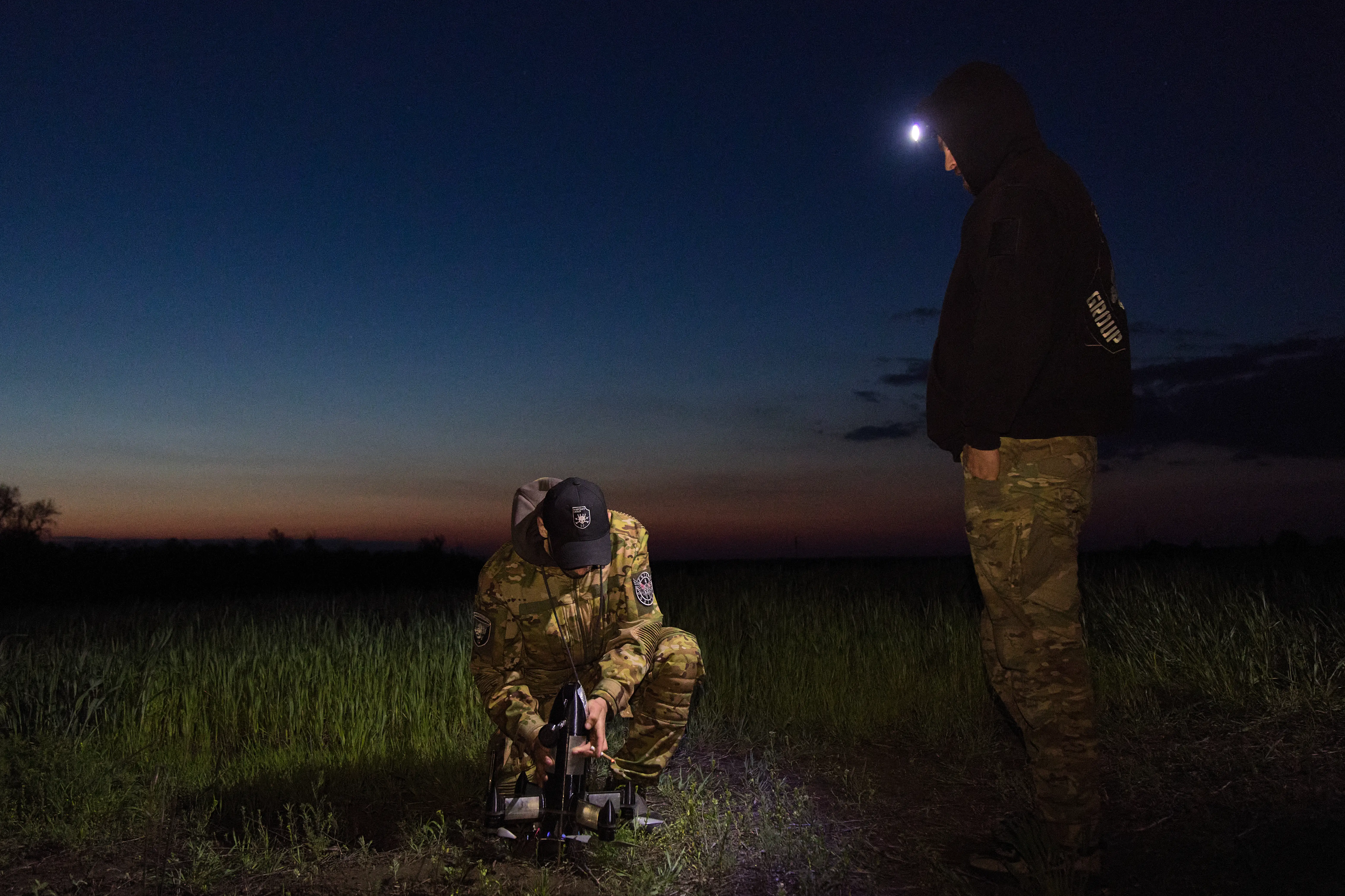 Ukrainian soldiers prepare to launch an interceptor drone during an air defense operation near the Donetsk front line on May 12, 2026.