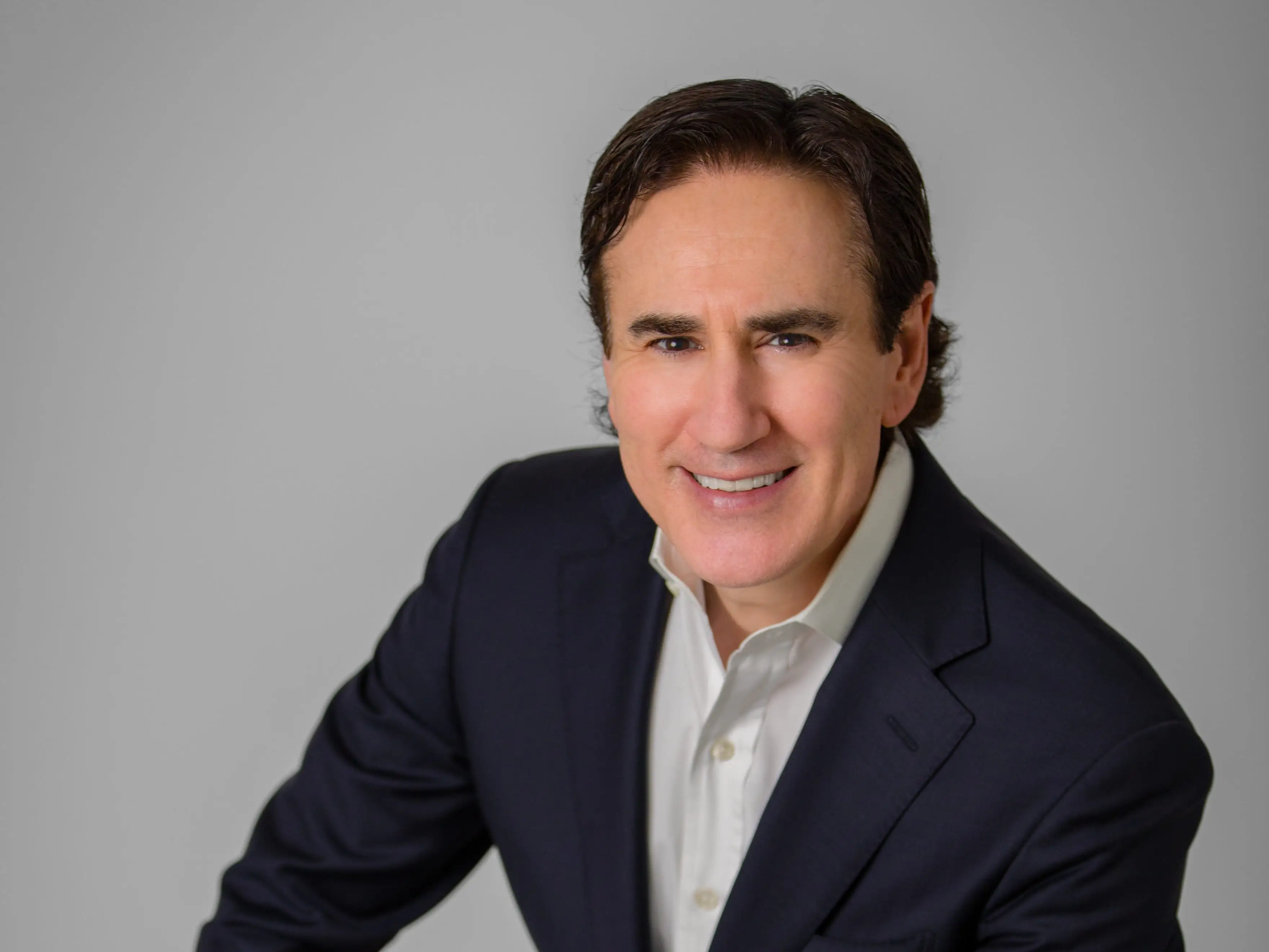 Josh Goldstein smiles in a portrait