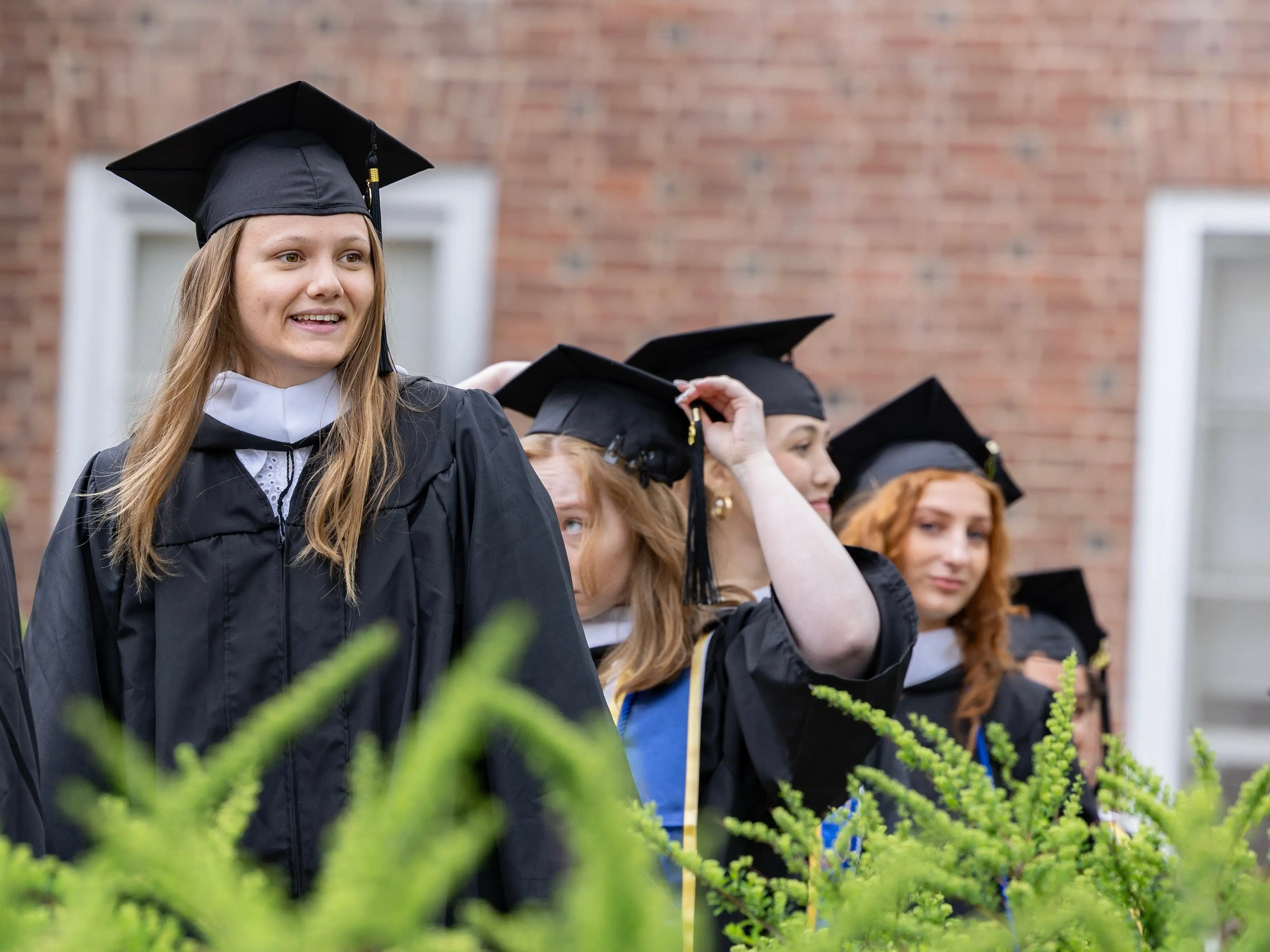 the author at graduation in a gown