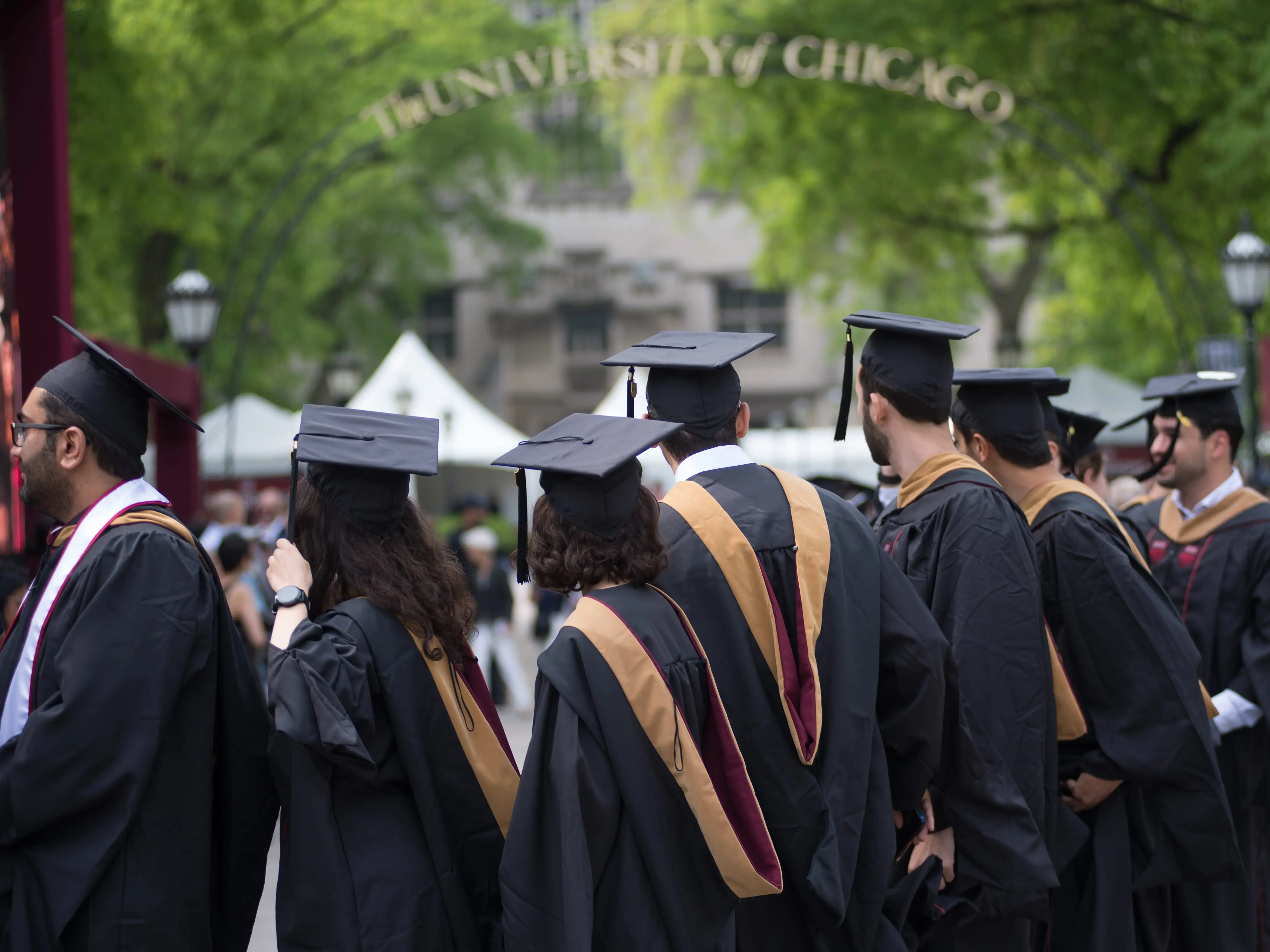 CHICAGO, ILLINOIS, UNITED STATES - JUNE 7: University of Chicago graduates celebrate during the commencement ceremony on June 7, 2025