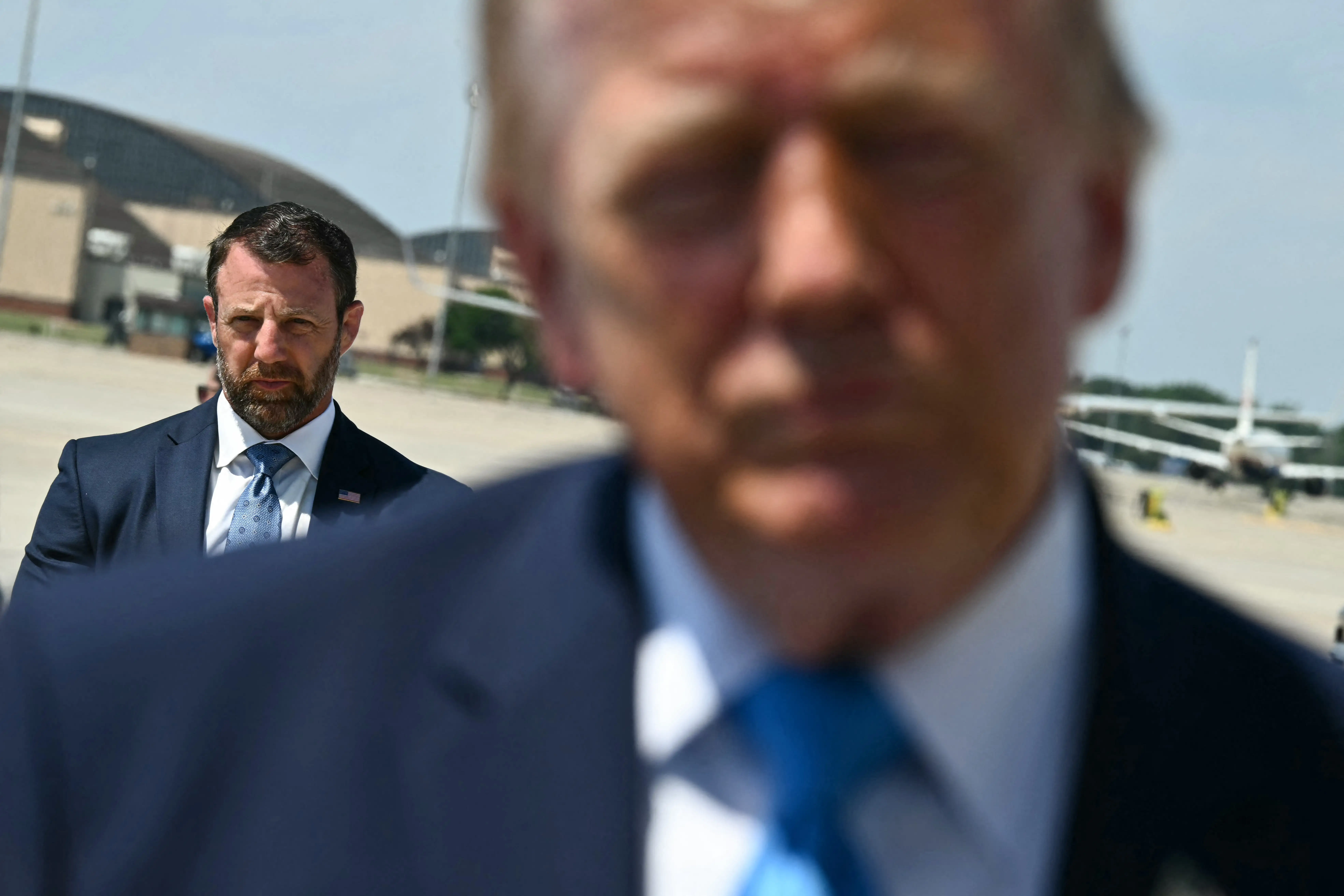 Markwayne Mullin, the new DHS secretary, has said he is considering cuts to customs agents at international airports in US cities that do not cooperate with his department's deportation efforts.