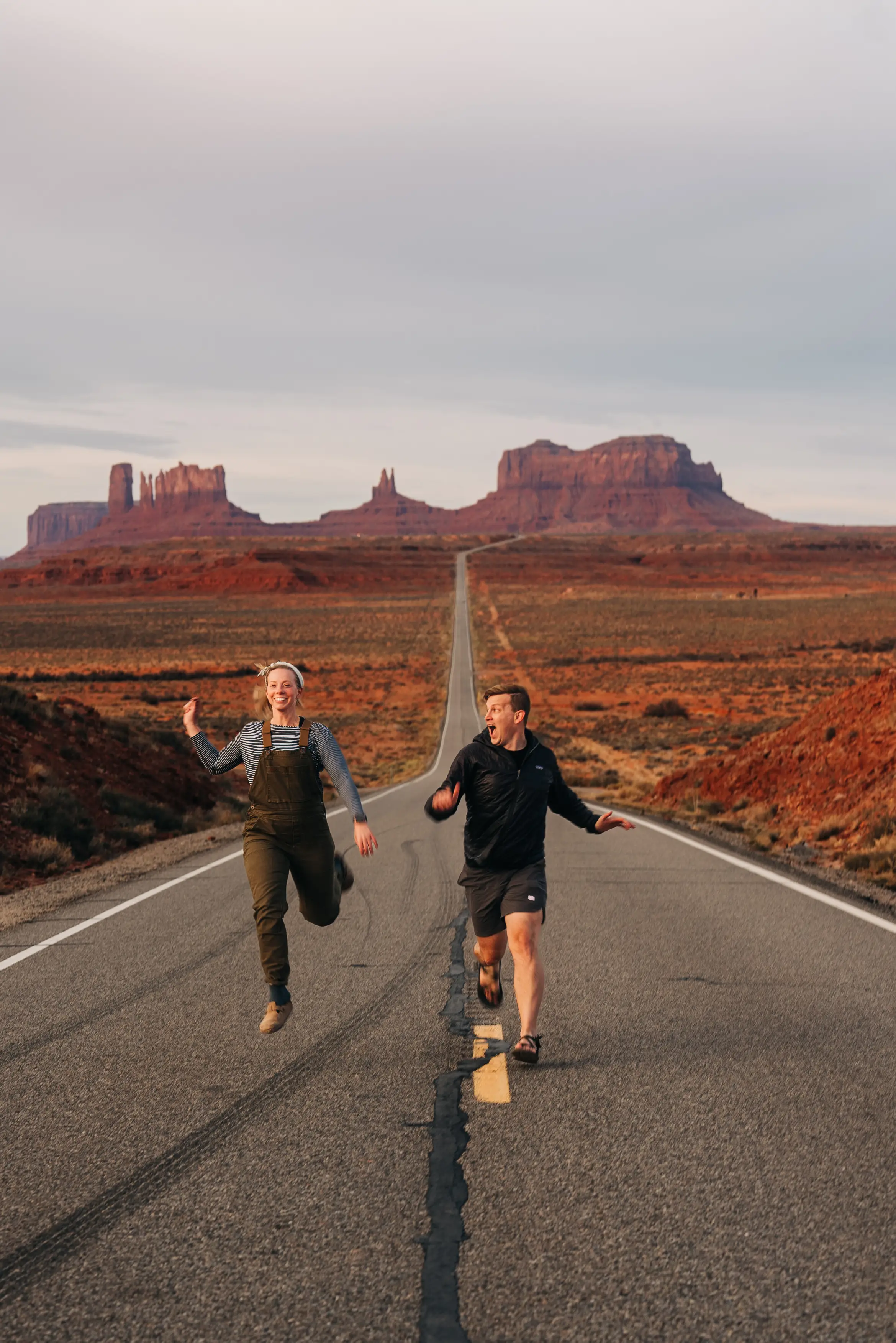 Chris and Sarah Aho running down the road together