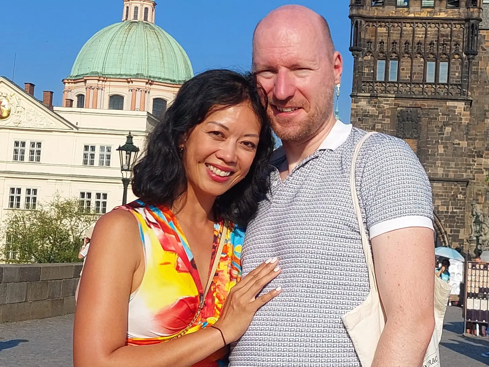 Lily Fen and her husband posing for a photo together in Prague.