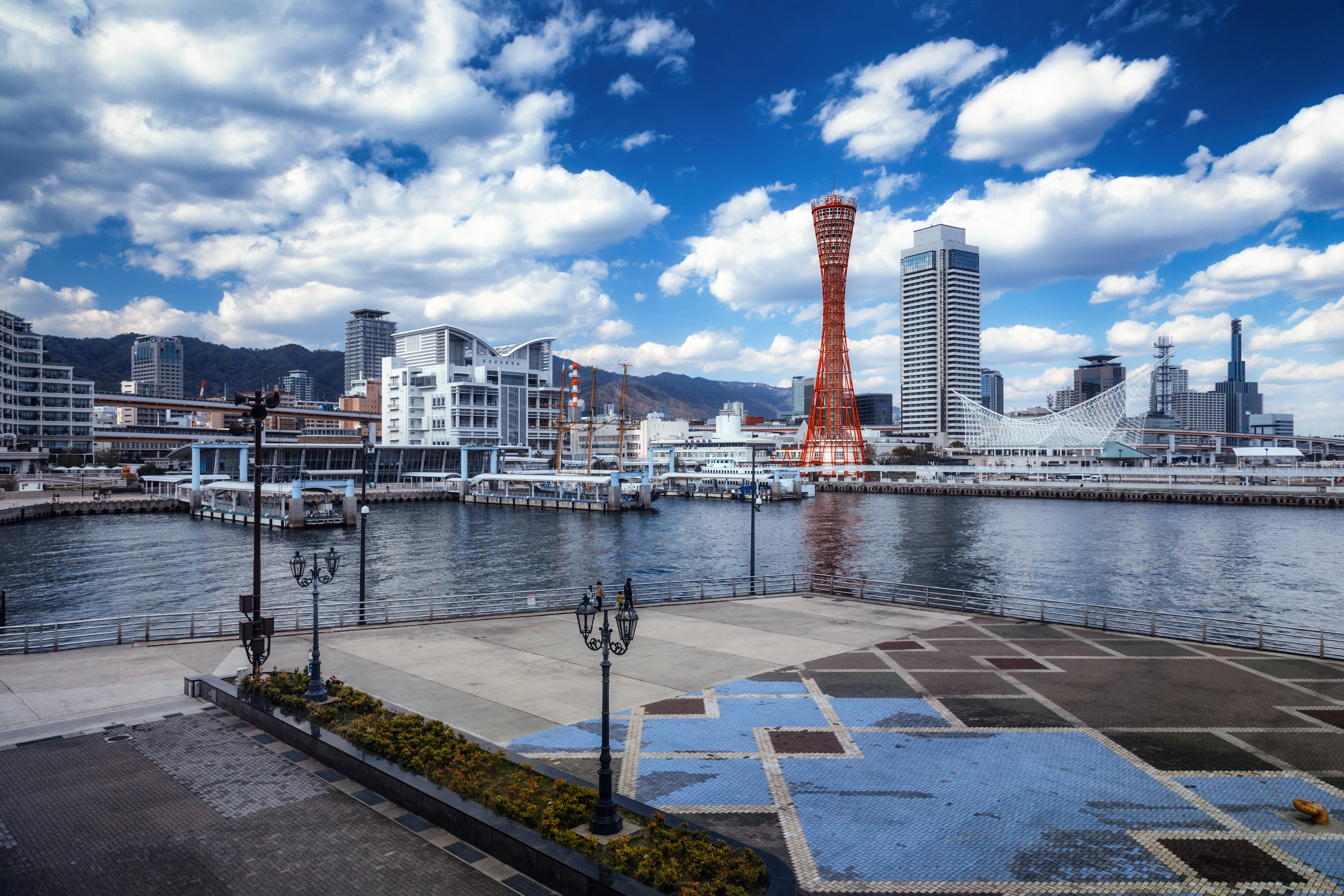 Wide angle view of quay and downtown buildings in port of Kobe city, Japan