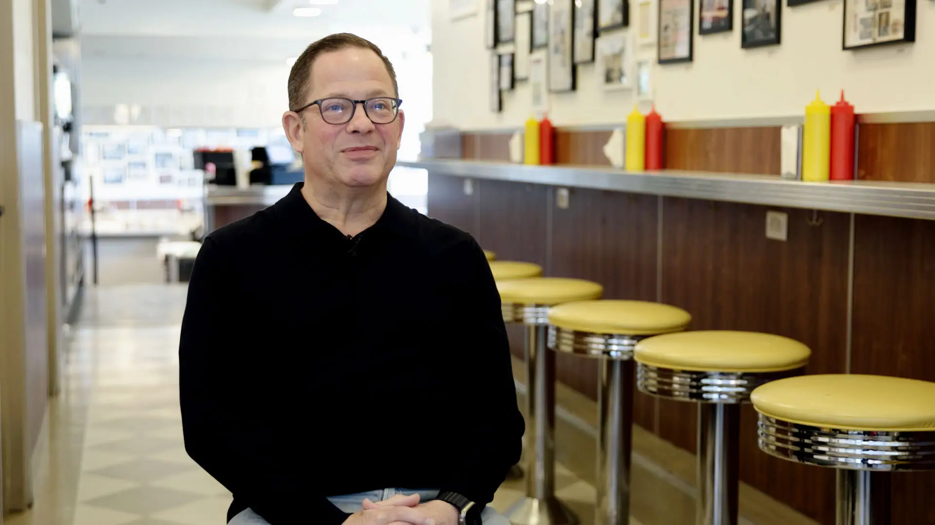 Andrew Schnipper is sitting in Hamburger America.