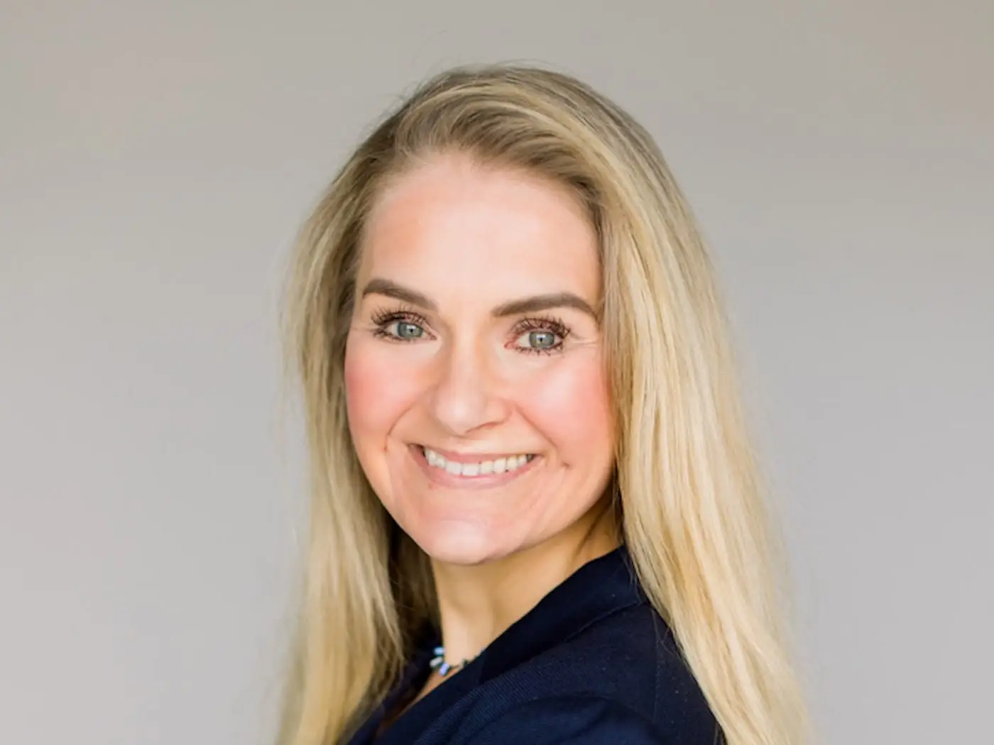 headshot of a woman with long blonde hair