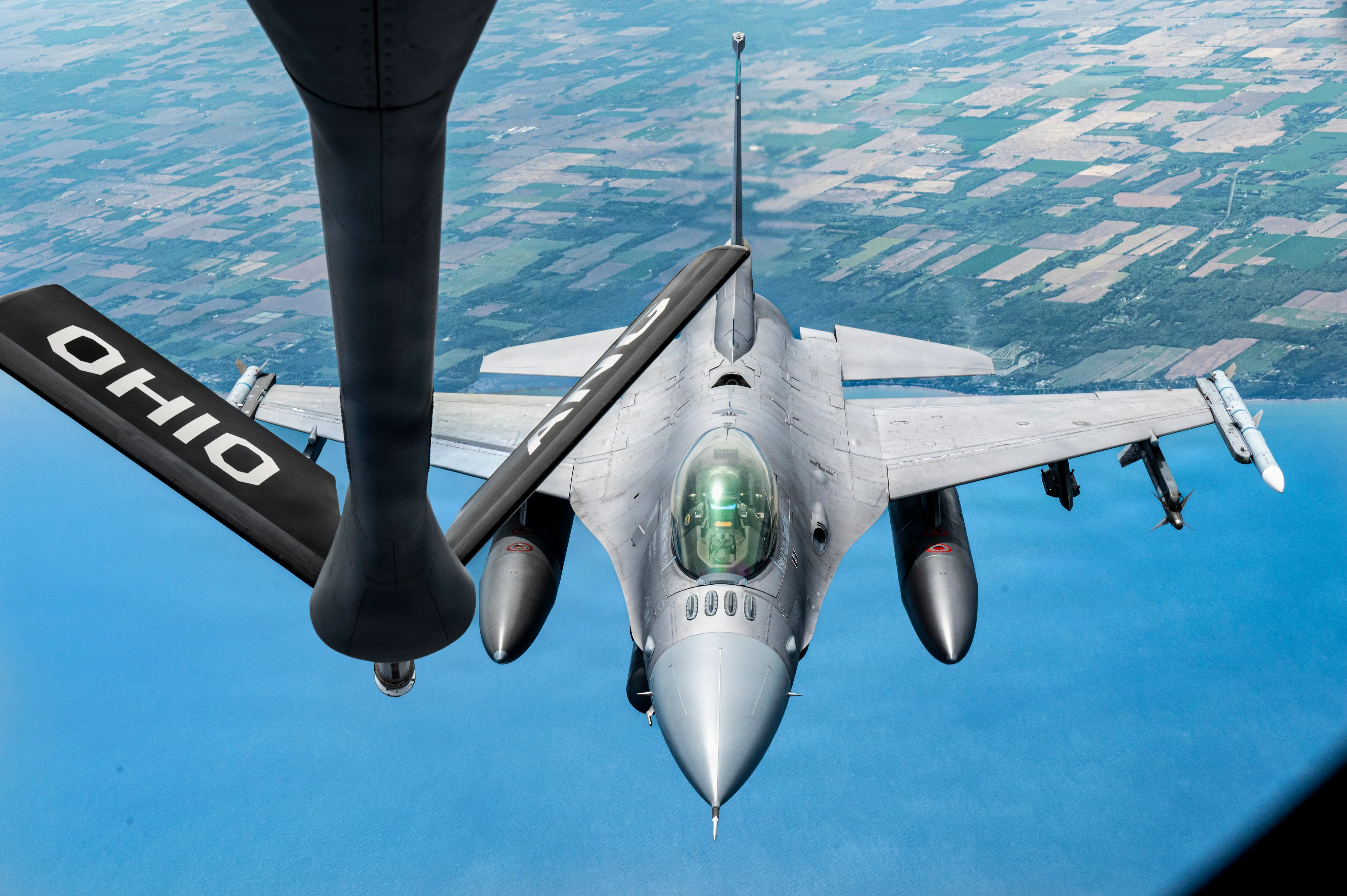 An Air Force F-16 jet and KC-135 Stratotanker prepare to refuel over Canada, on May 20, 2026.