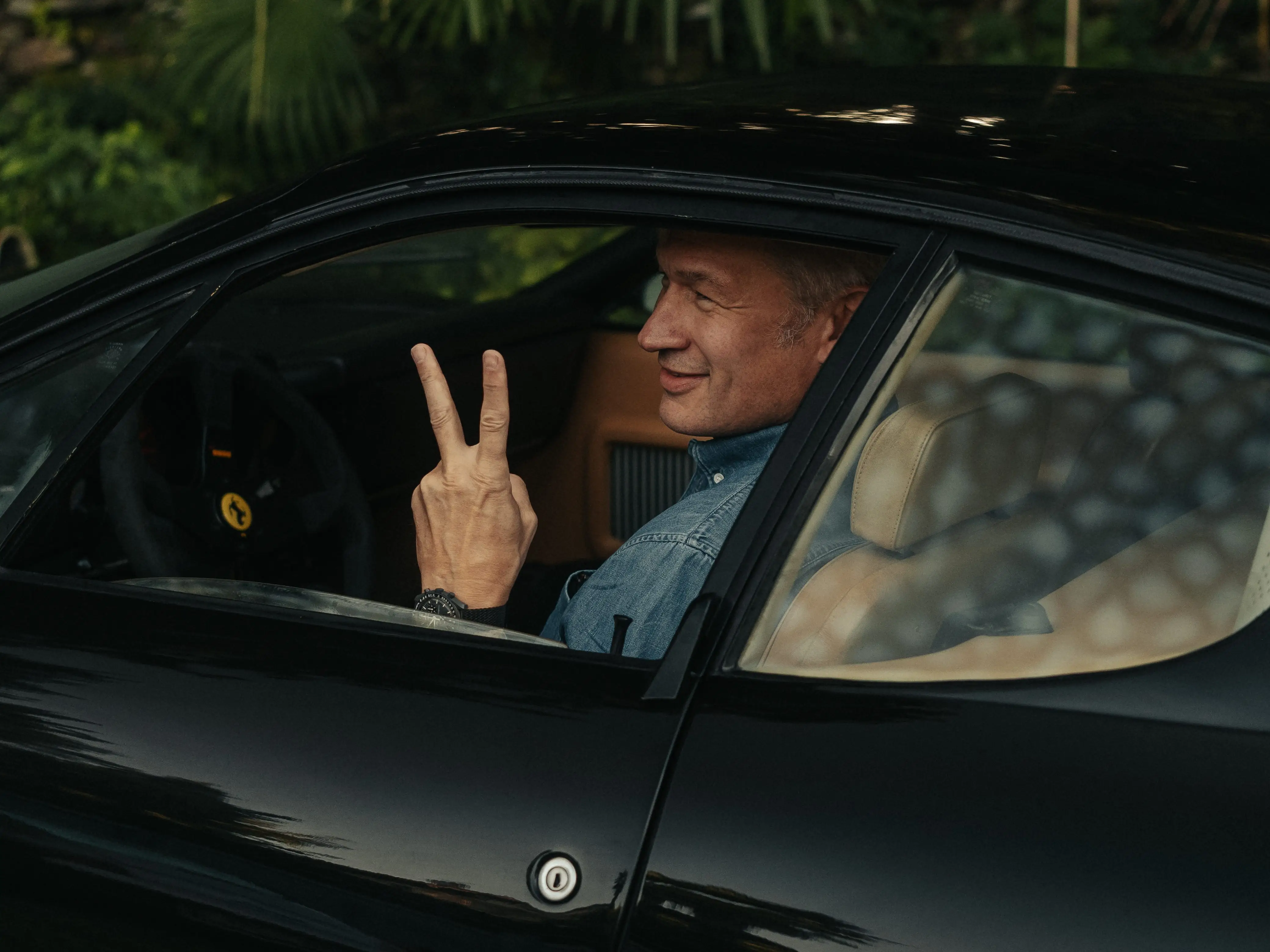 The author sits in one of his Ferraris