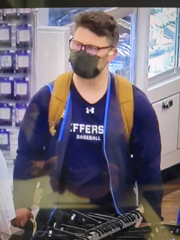 Security video showed a masked man entering the store with a backpack and loading a grocery cart with camping fuel and several boxes of fireworks, officials said.
