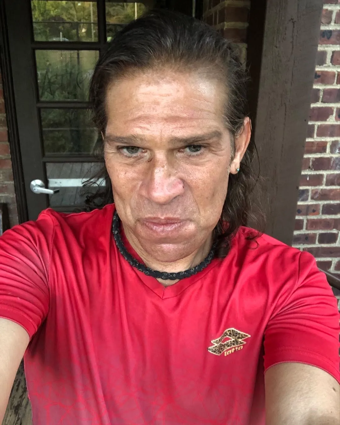 Jonathan Tiersten wearing a red shirt.