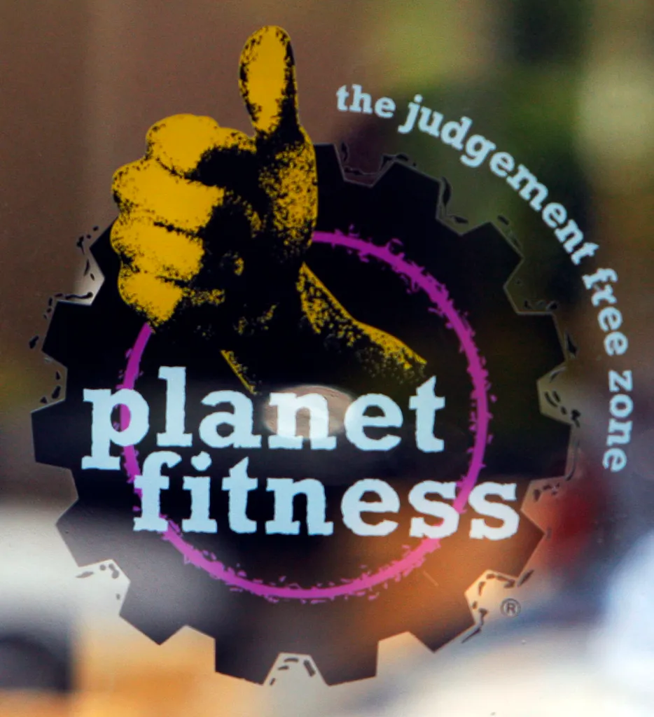 Planet Fitness logo with a yellow thumbs-up, black gear, and text 