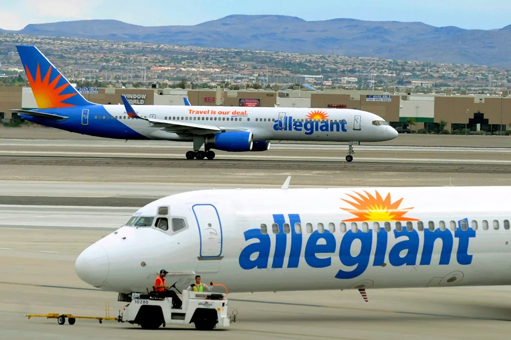Two Allegiant Air jets taxi at McCarran International Airport in Las Vegas.