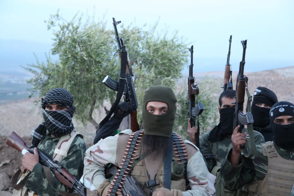 Five ISIS rebel militant soldiers posing with rifles.