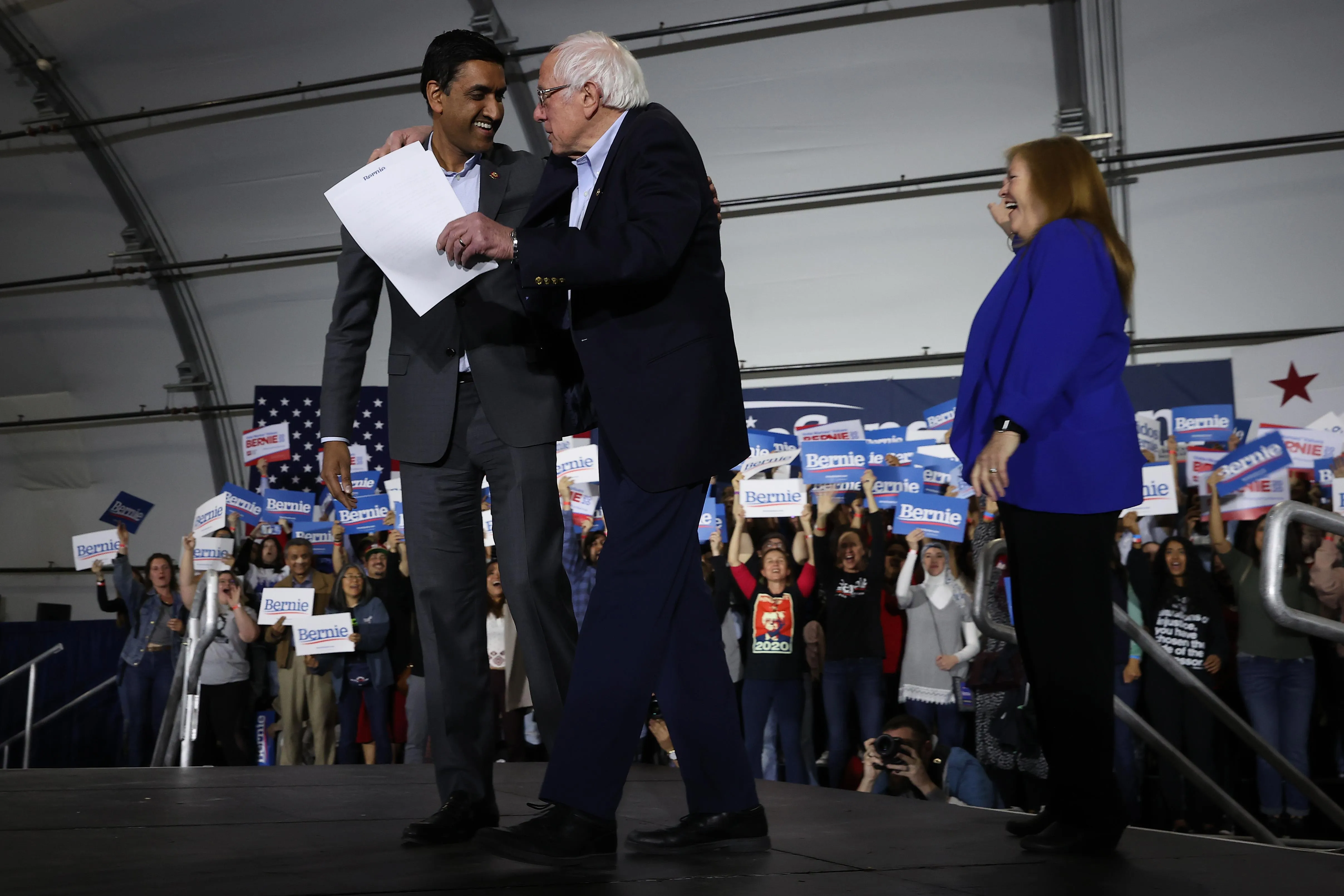 Bernie Sanders embracing Ro Khanna at a rally