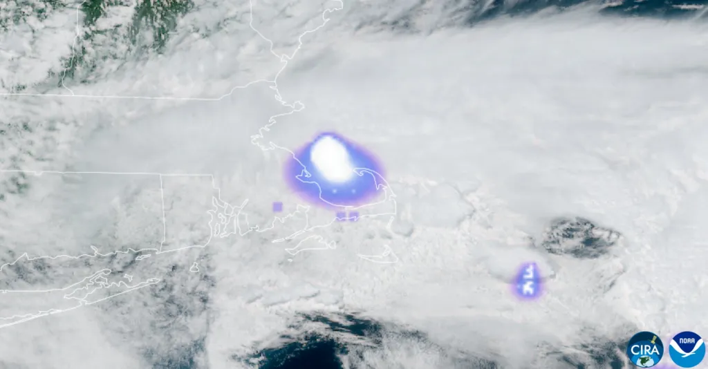 Satellite image showing a bright, glowing meteor with a purple haze over New England and the Atlantic Ocean.